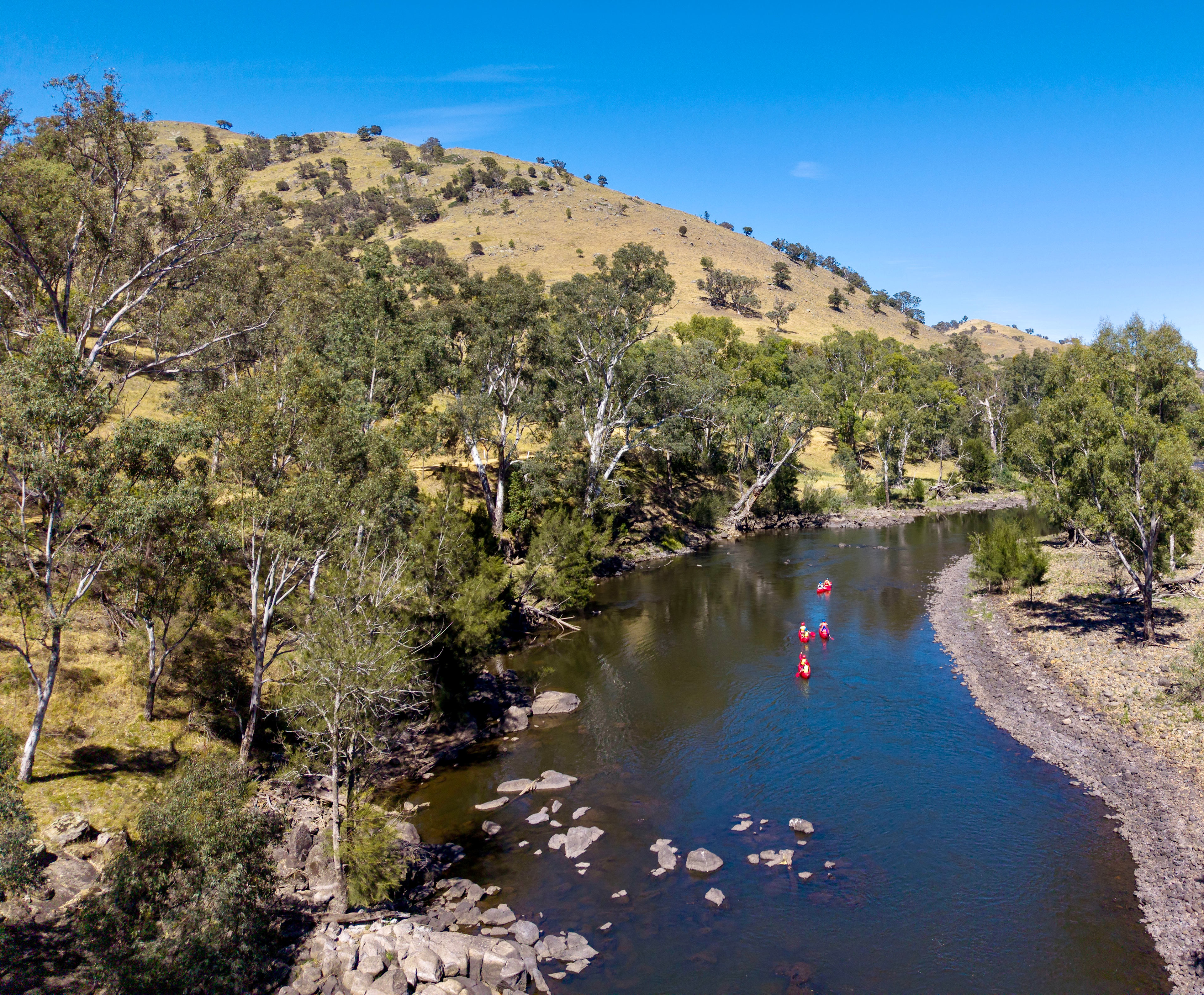 Canoes paddling down the river 