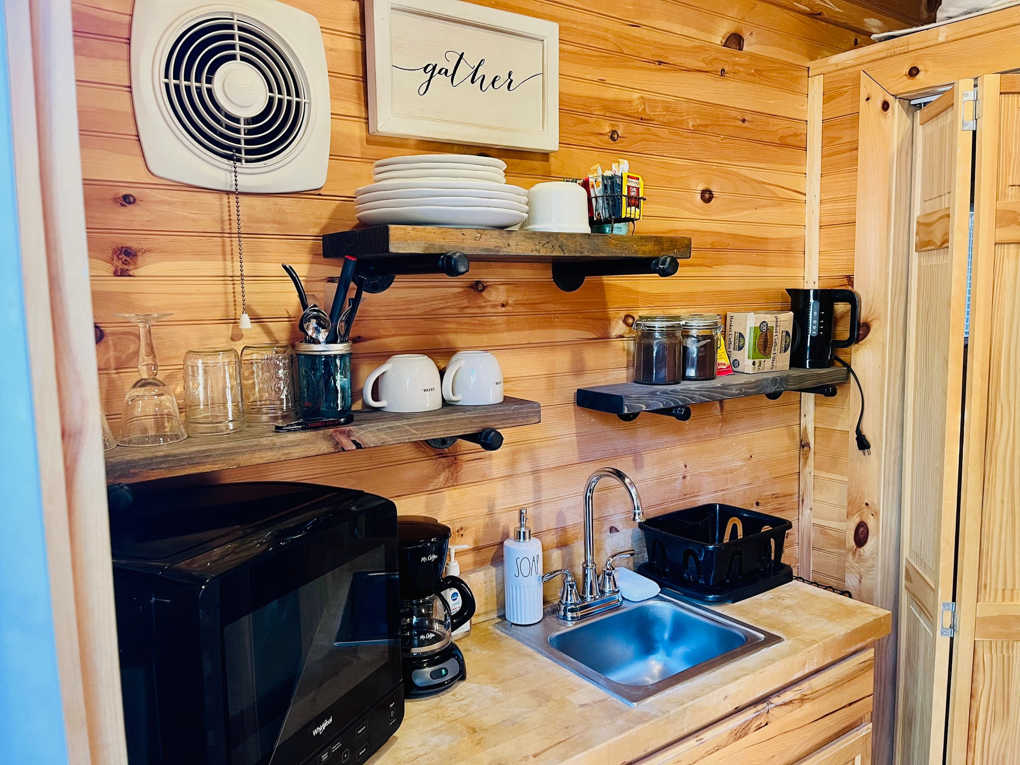 The kitchen features a mini-fridge/freezer, microwave, coffee maker, and anything you need to enjoy a meal.