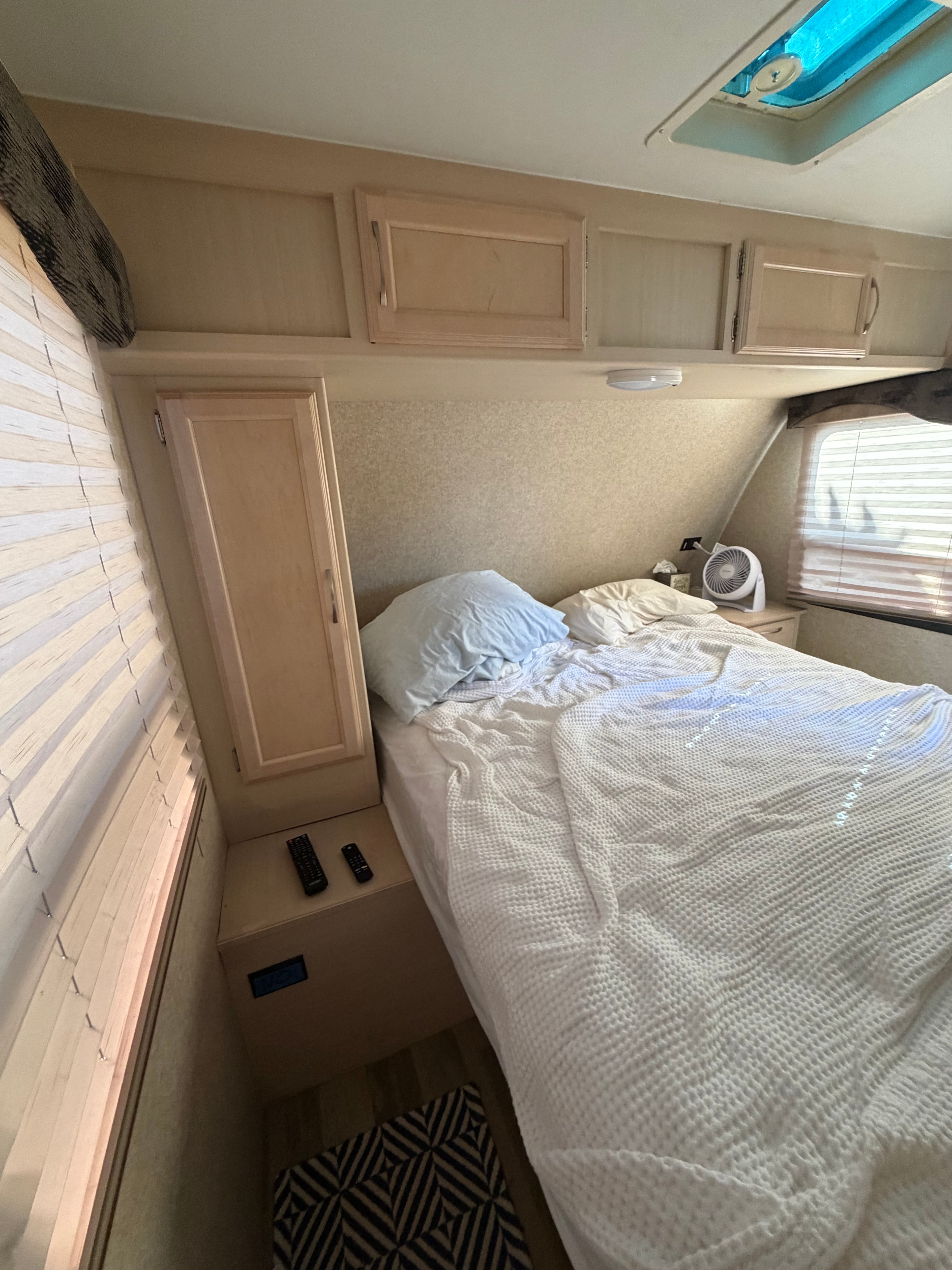 Master bedroom, has a small closet with hangers on the side