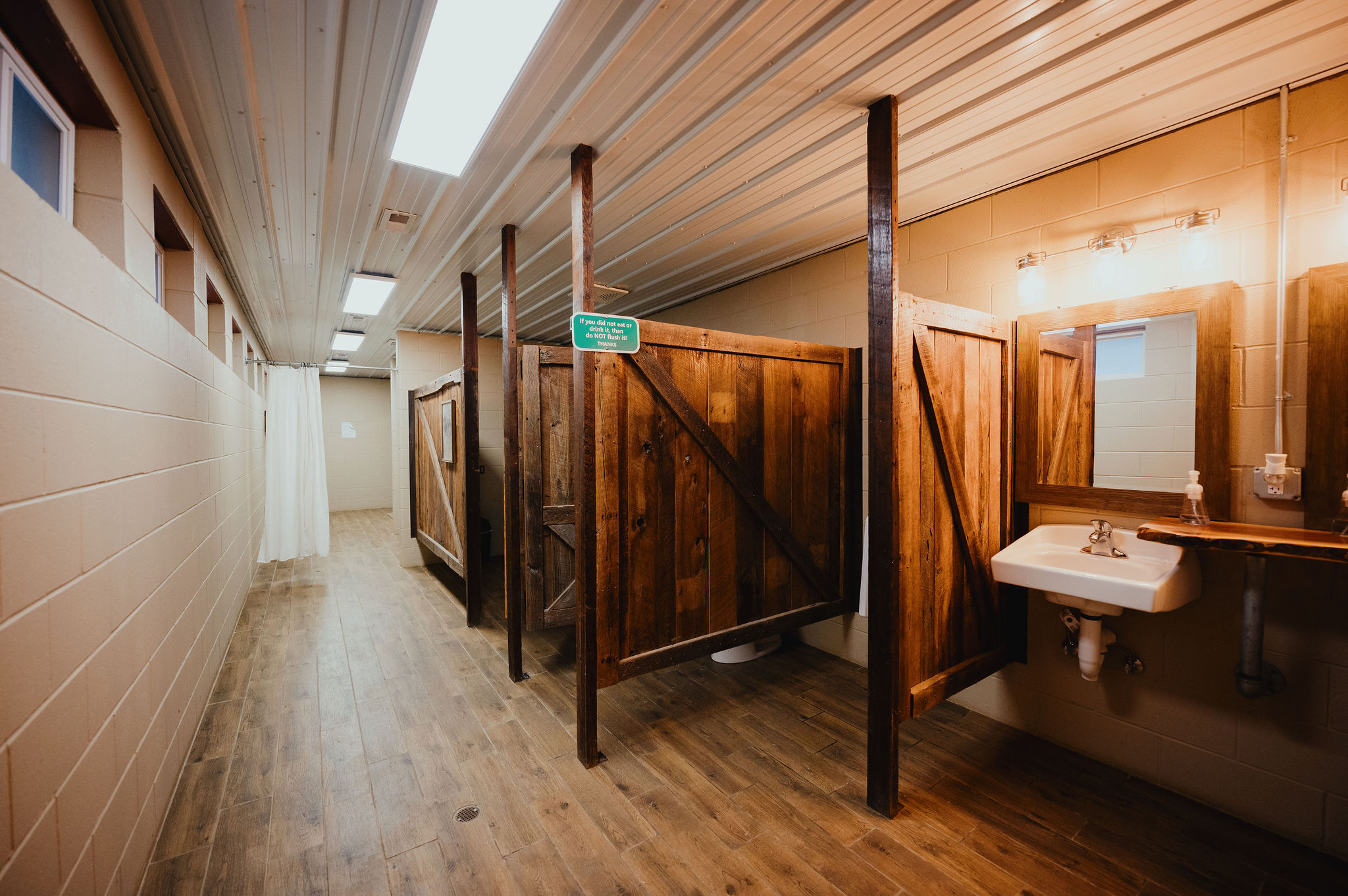 Clean, well-maintained bathhouse with private shower and restroom areas