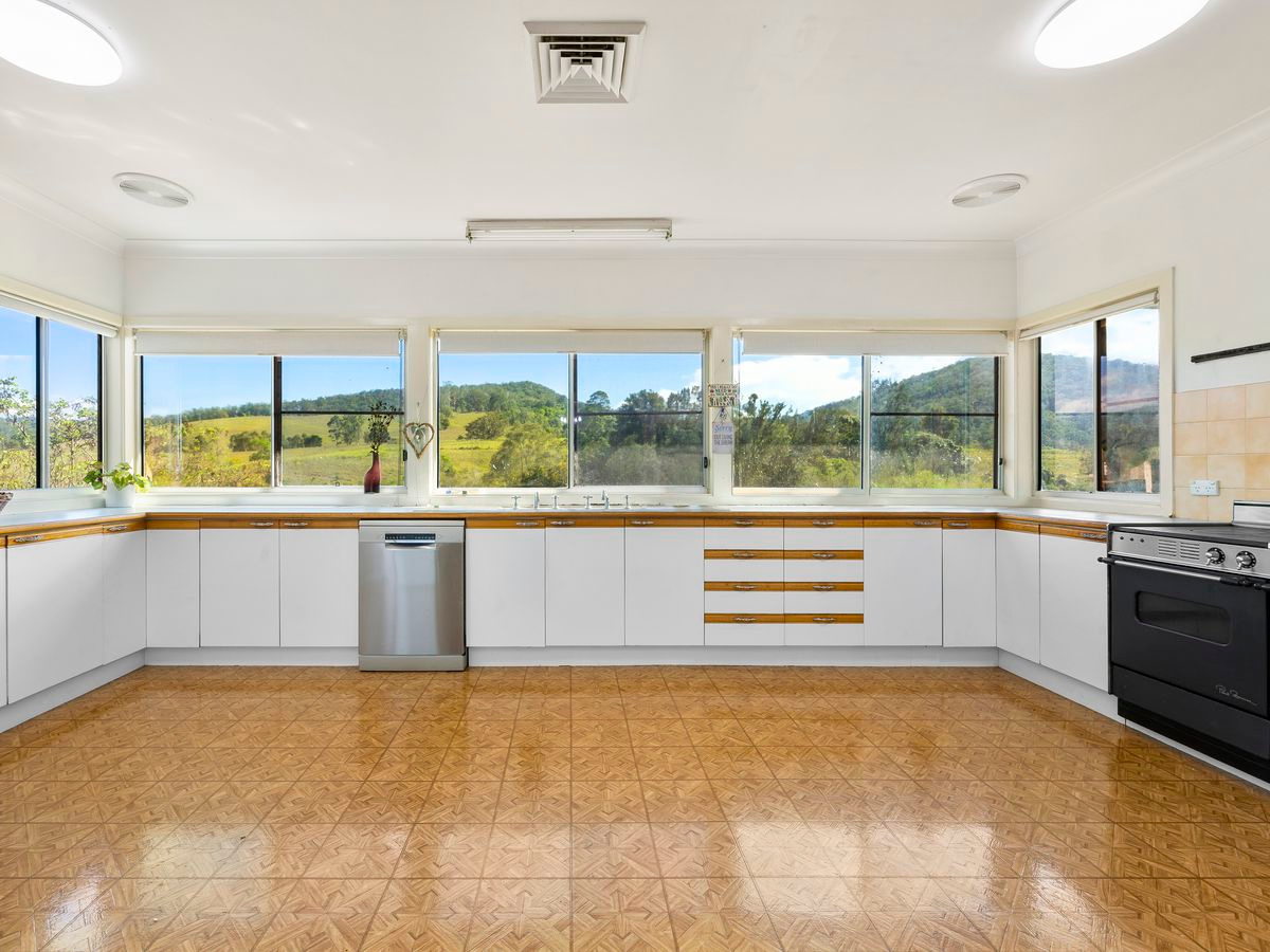 You'll be looking straight out onto that river in front of the house every day through these expansive kitchen windows. Top class appliances included!