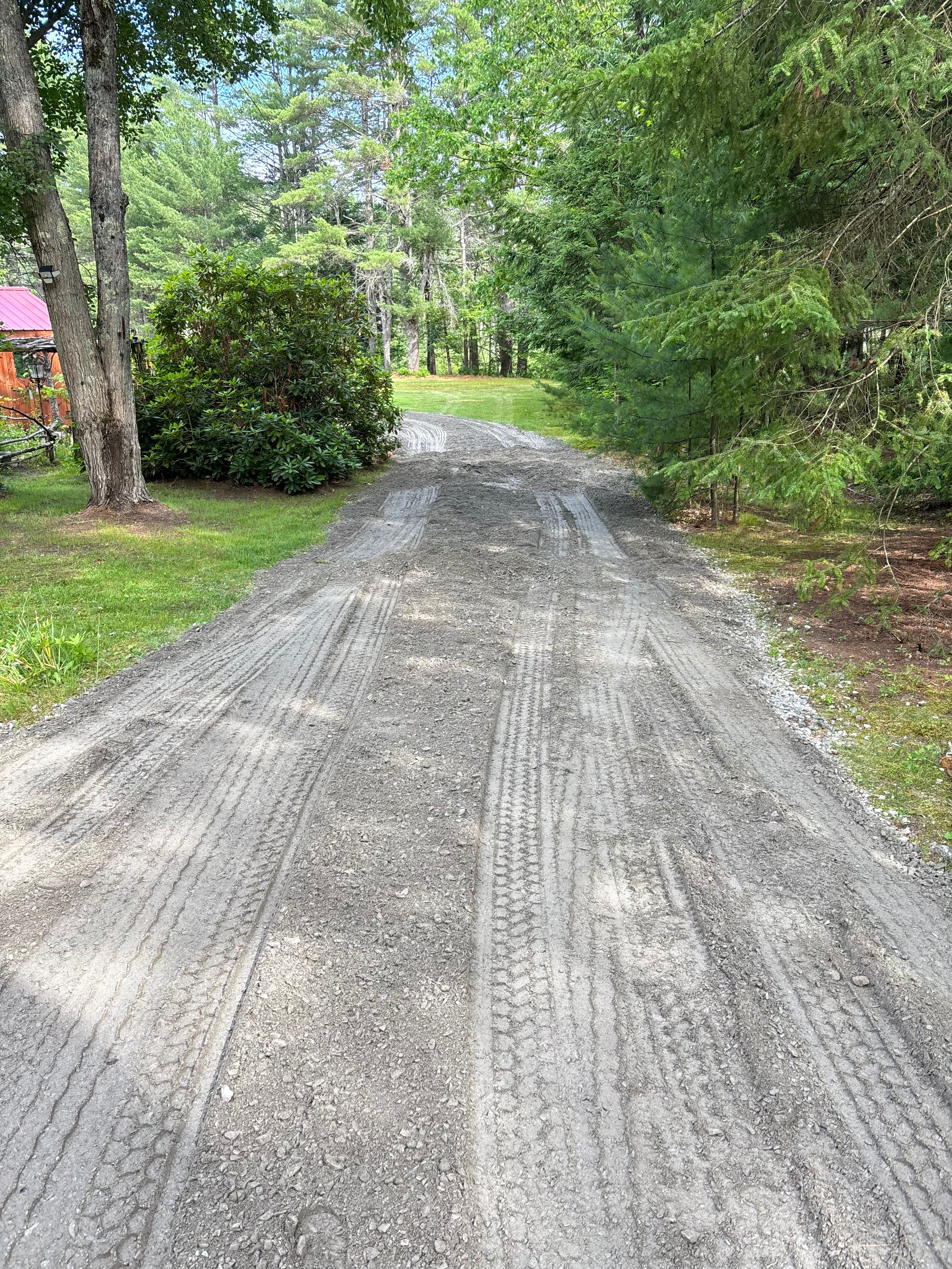 "Reliable All-Weather Access: Our custom-built gravel turnaround features a multi-layer stone base and hard-pack finish, ensuring a firm, level surface for easy 180-degree exits—even during the wetter seasons."
