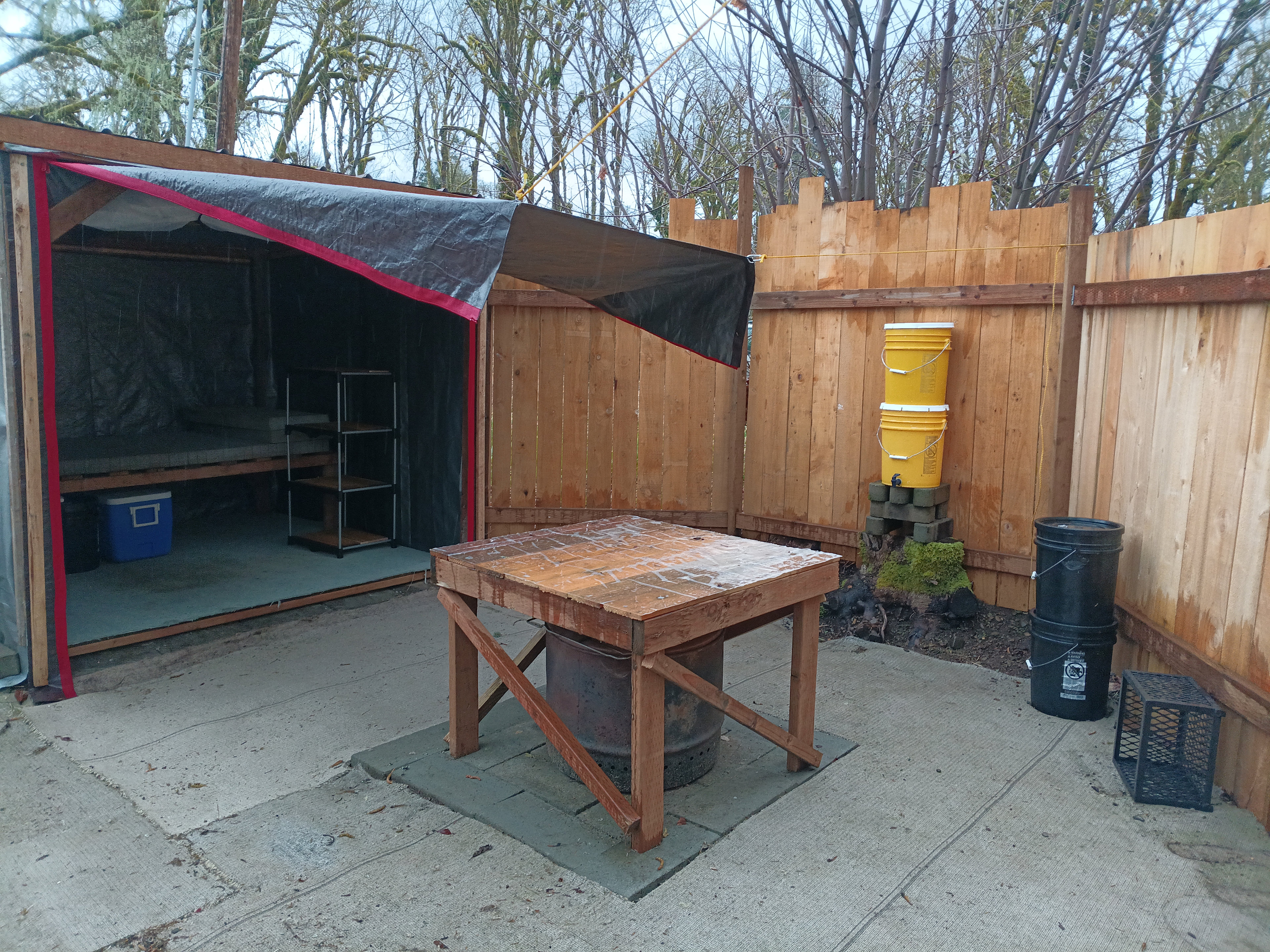 8' x 8' sleeping shed, filtered rainwater system and smokeless firepit.

