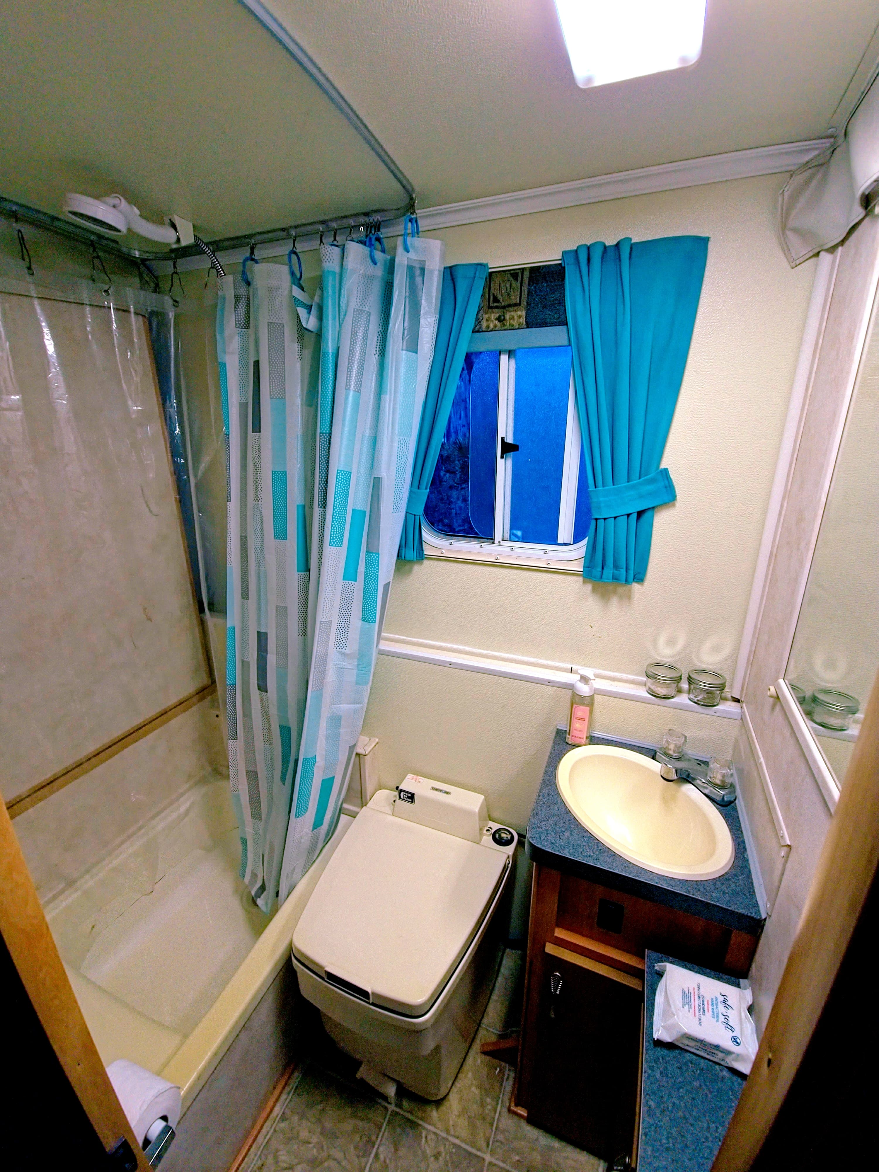 Your private bathroom with a small tub/shower and hot water 