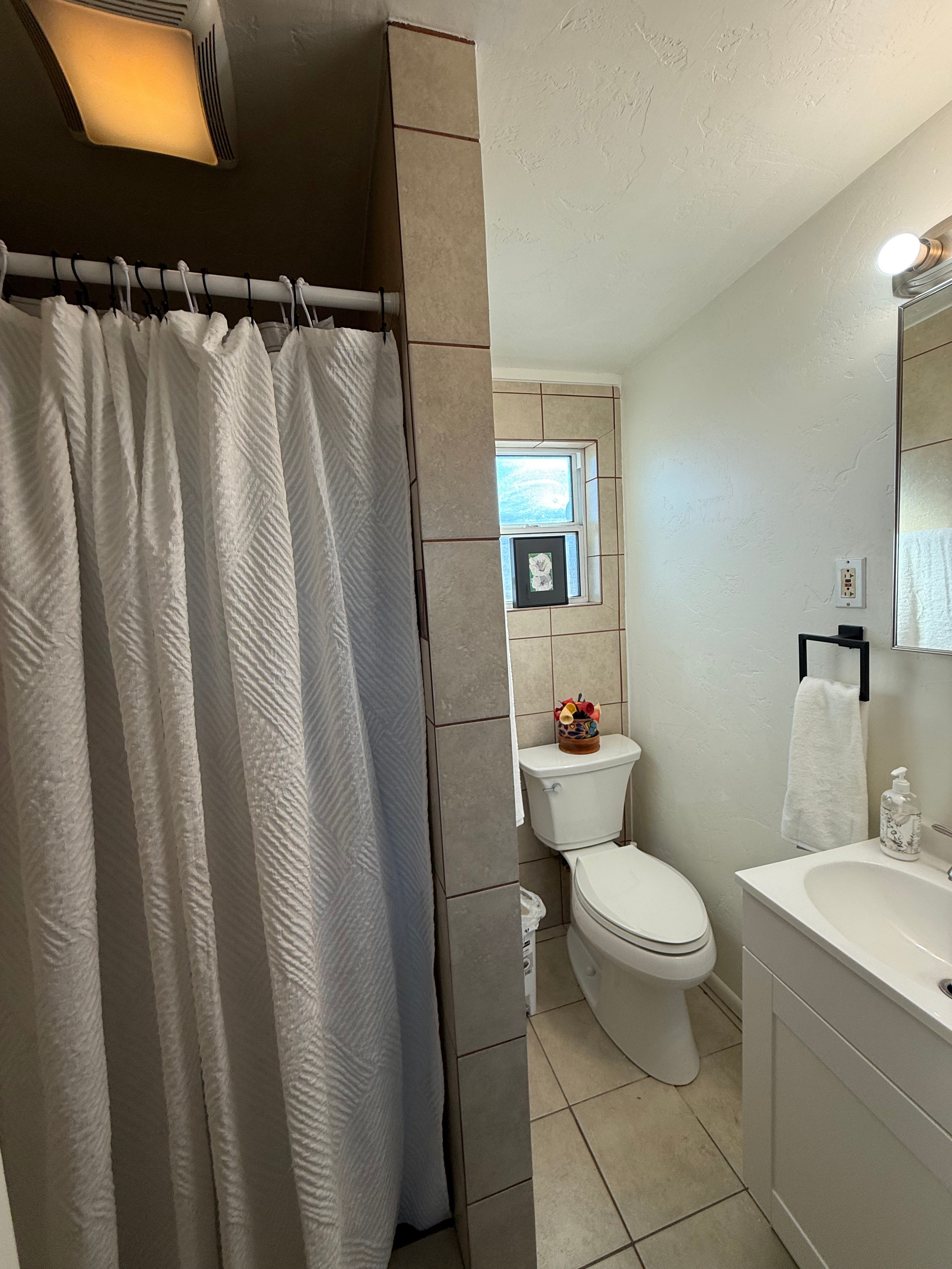 Our tiny home has walk-in shower with crisp white towels and starter shampoo, conditioner, and soap to make your stay comfortable!