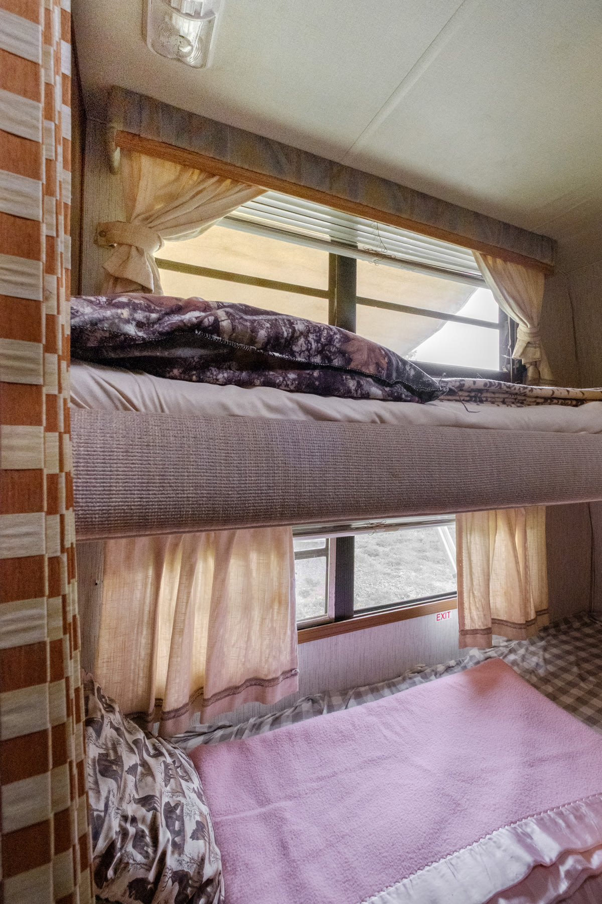The camper sleeps up to 7 people, 2 of them in the bunk beds in the back.