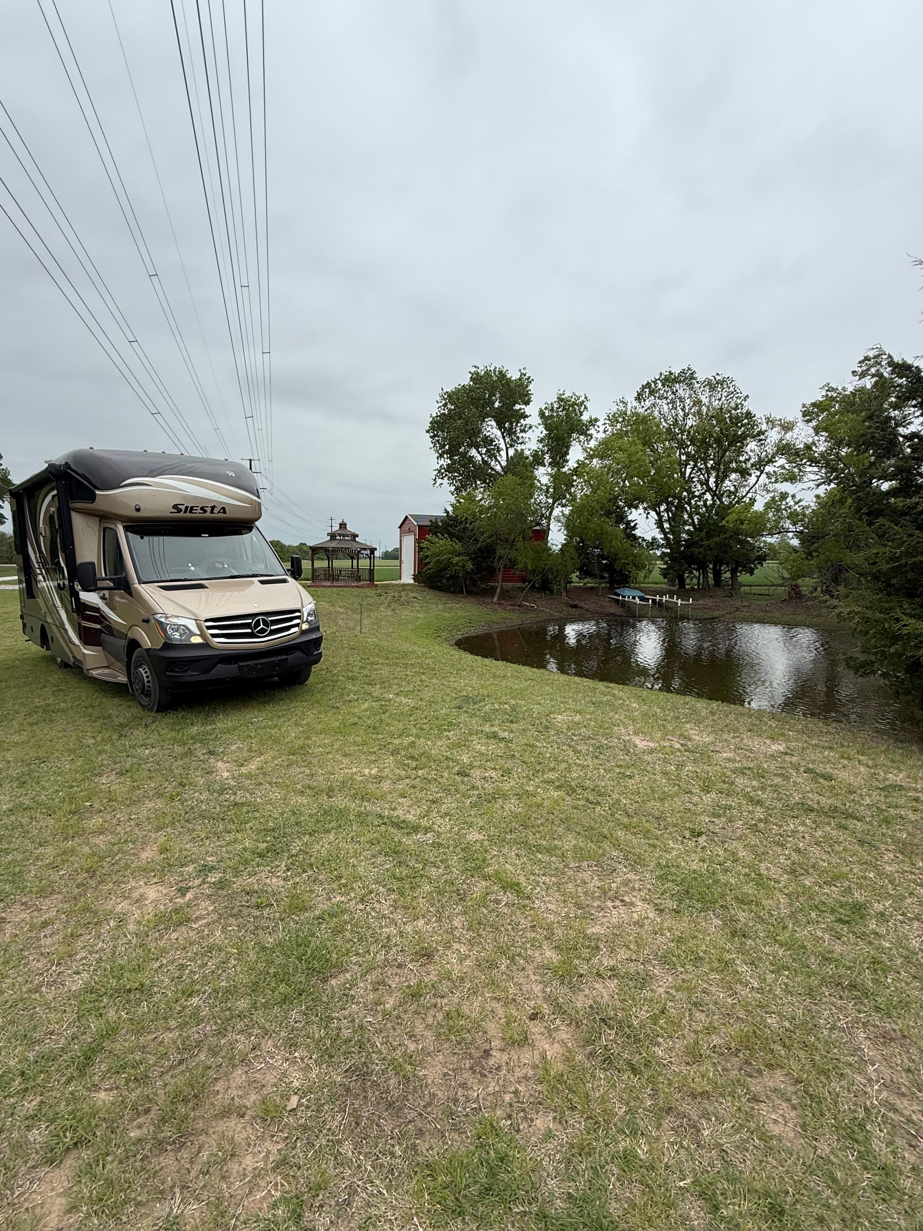 RV Camping Next To Pond & Gazebo
