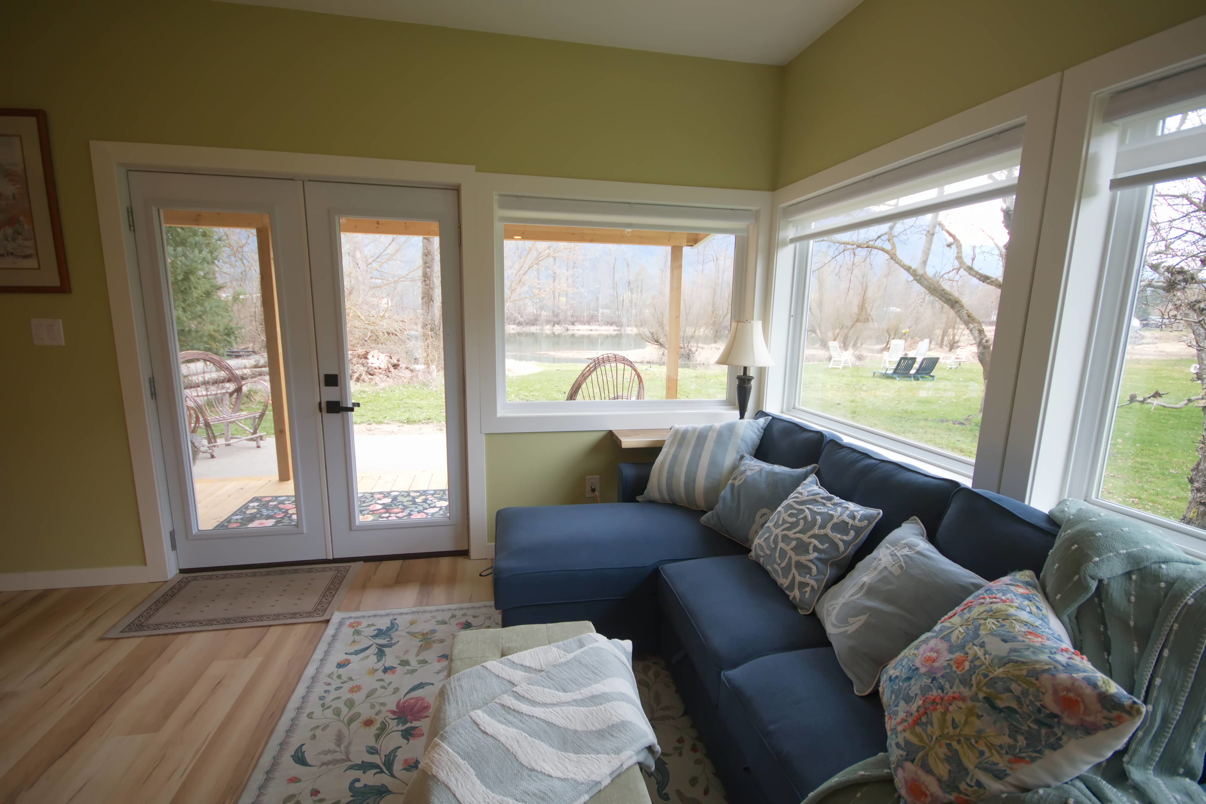 Sectional sofa in living area that pulls out to a double bed.  View of your space and the river.