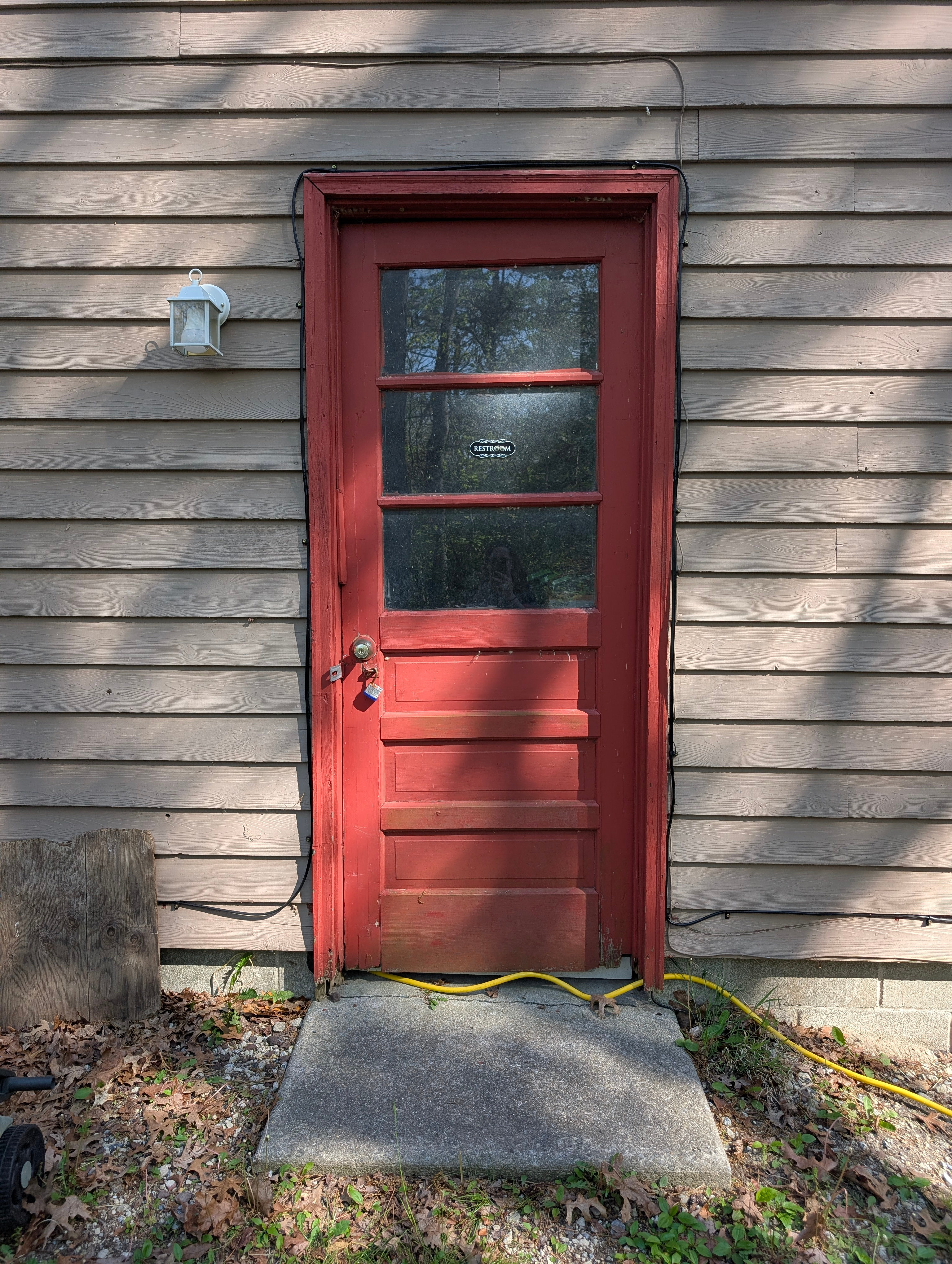 Restroom access door, side of garage