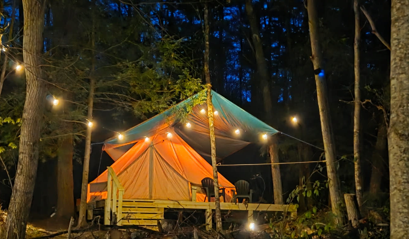 Riverfront Adirondack Glamping Yurt at night