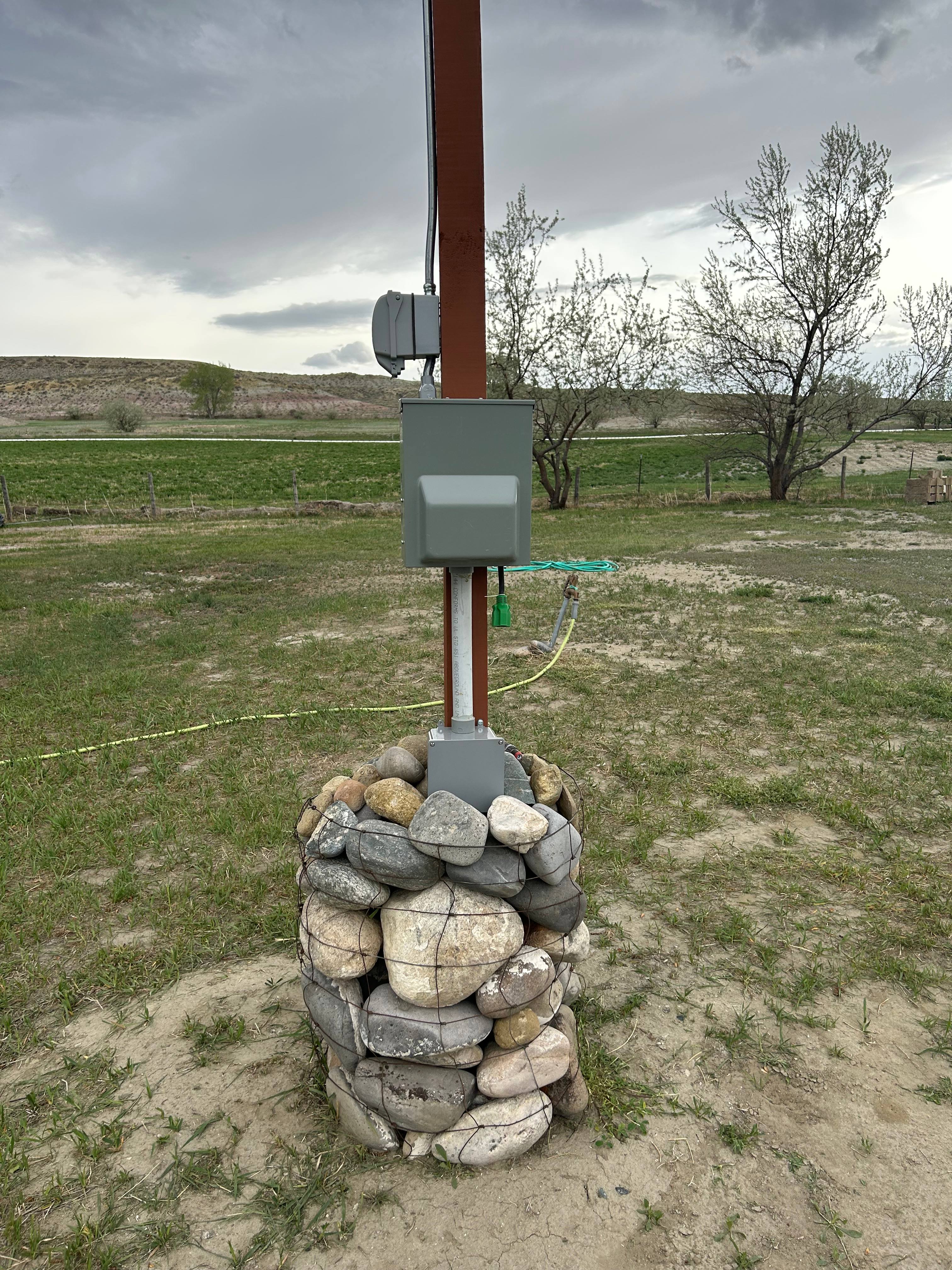 Electric hookup on pole. 