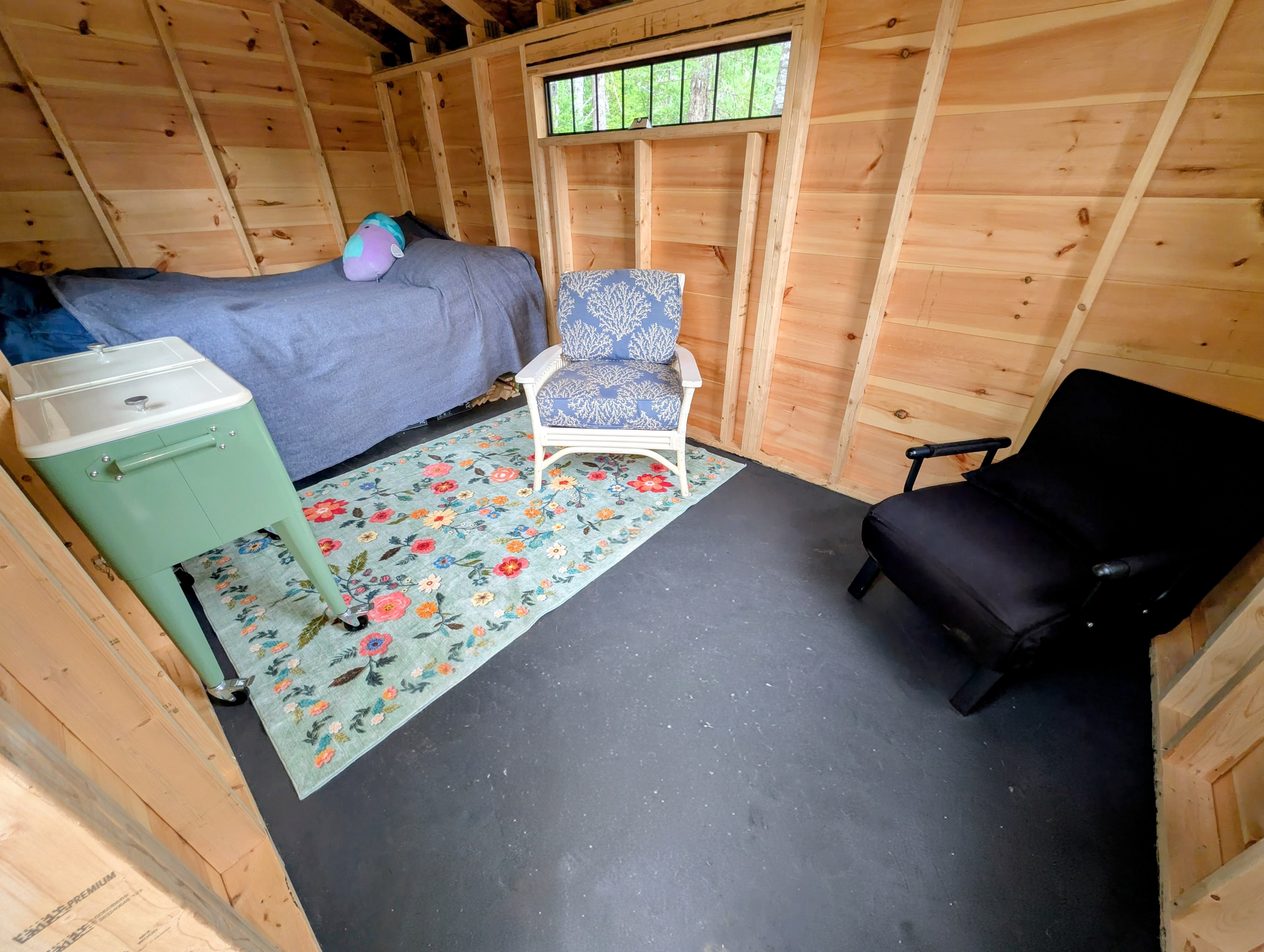 The black chair cam fold out into a cot. 