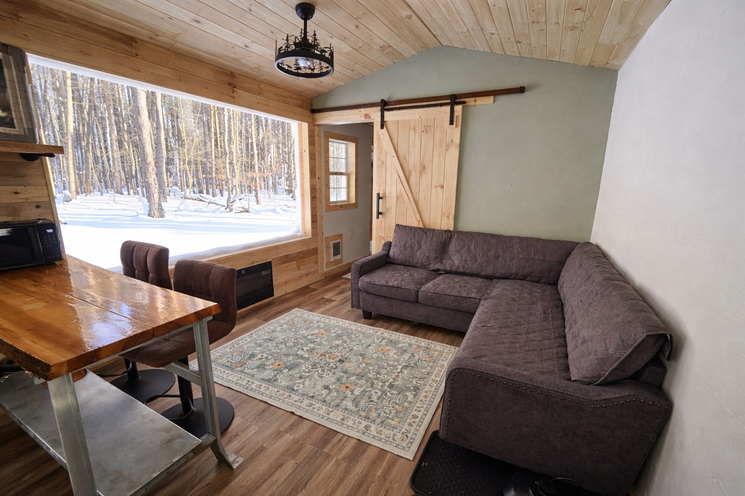 Imagine sipping your coffee overlooking the woods every morning and afternoon by the electric fireplace. The cabin is heated & has window AC. 