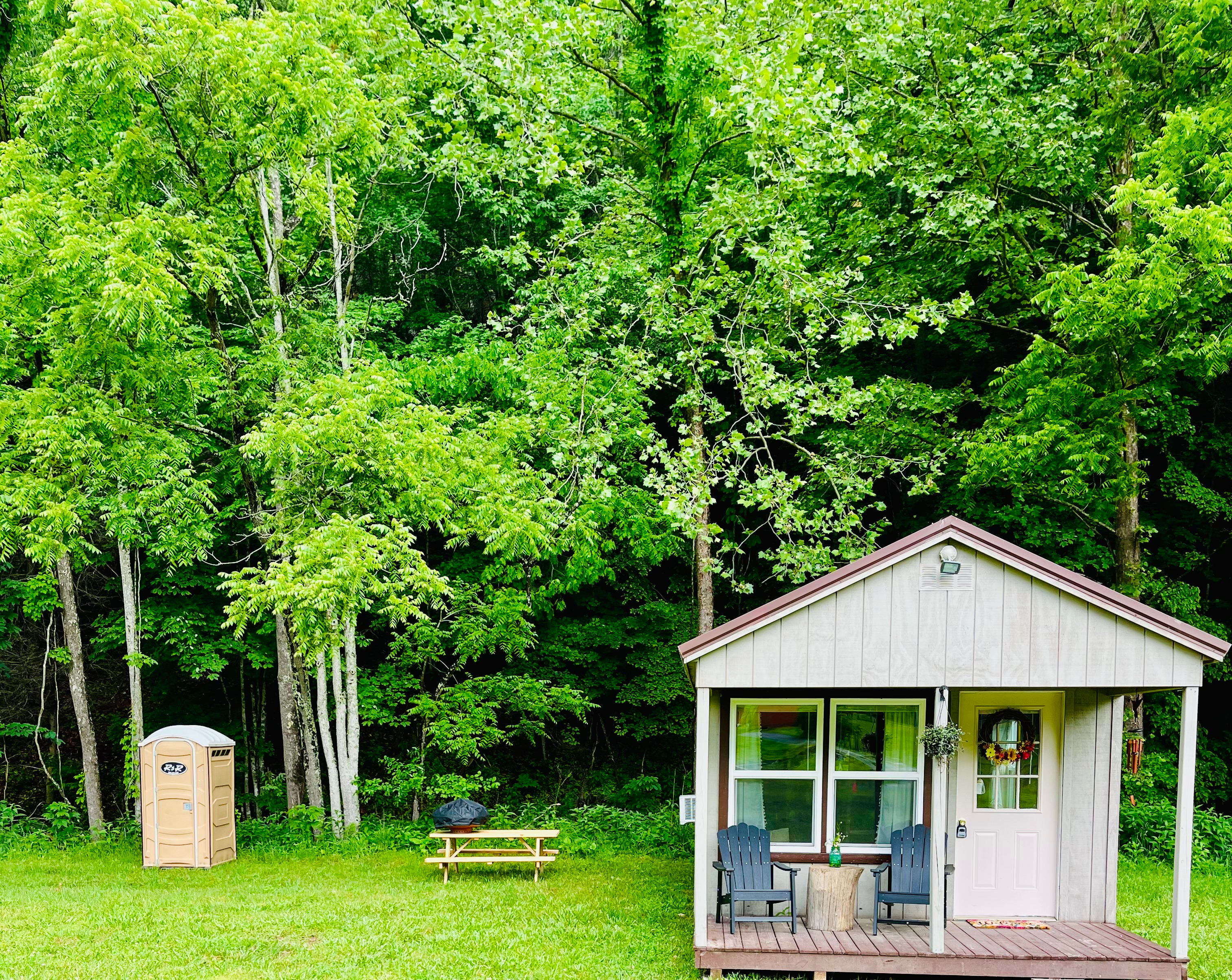 Private and well maintained Porta potty, picnic table, fire pit and charcoal grill. 