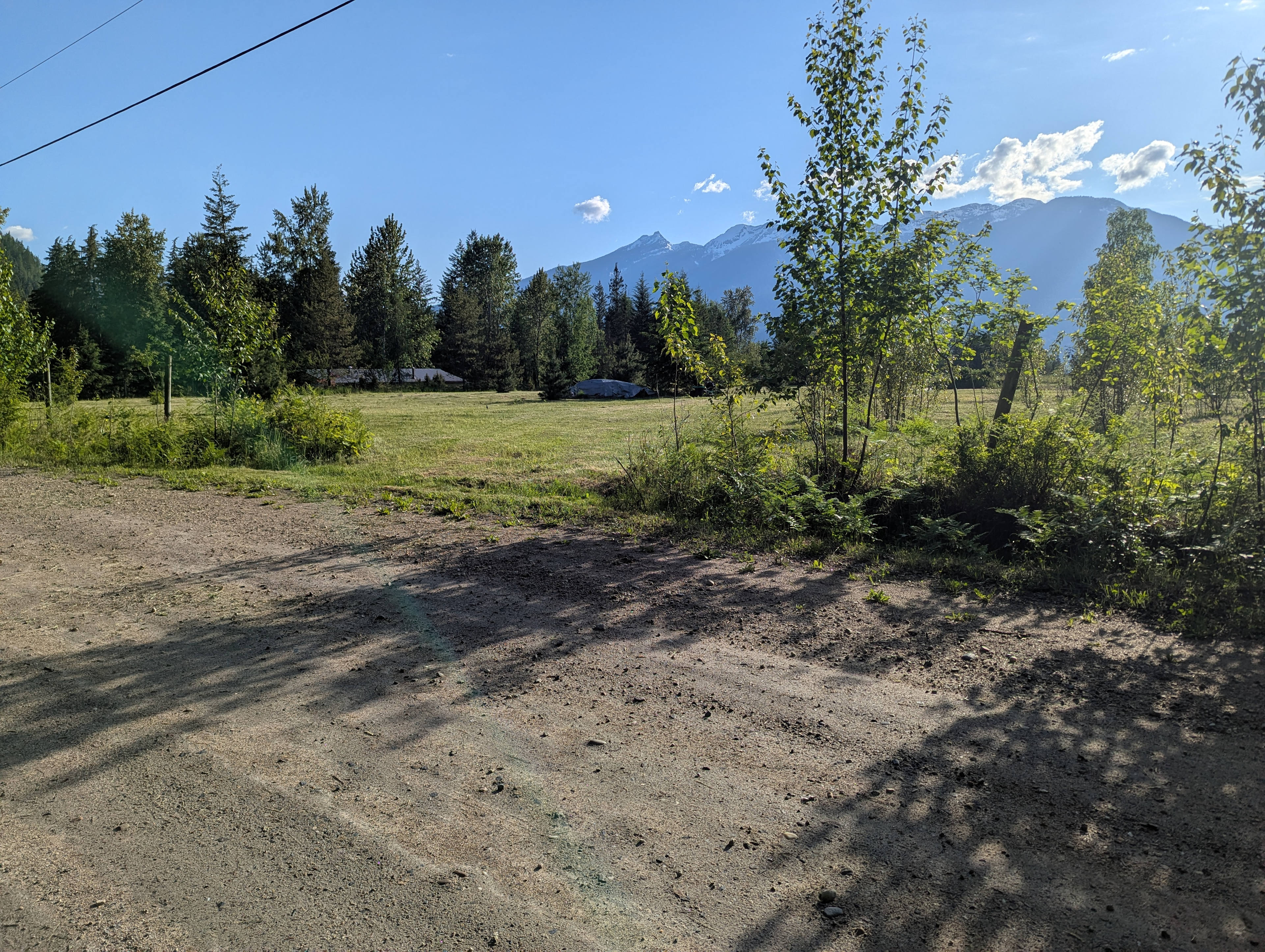 Entrance from well maintained access road to field. Only about 100m of gravel road to get to the field entrance. 