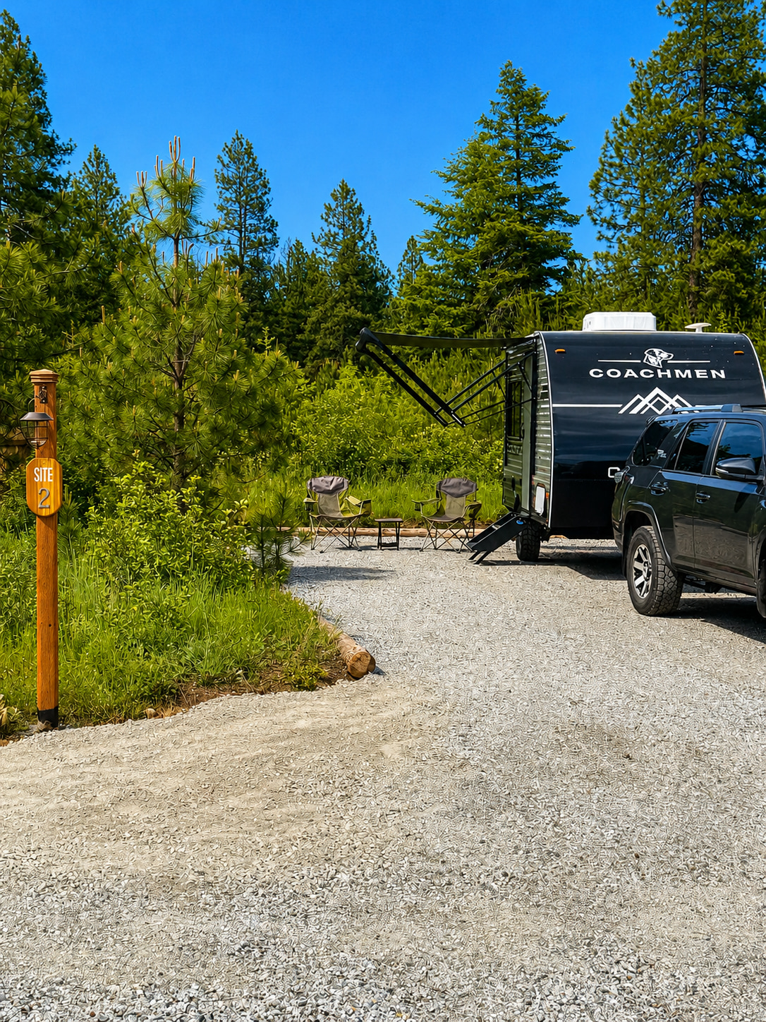 Site 2 entrance from camping road. This spacious site can hold up to a 60 foot motorhome or truck-trailer combo. No need to unhook...unless you want to! There is overflow parking available too at no extra charge. 