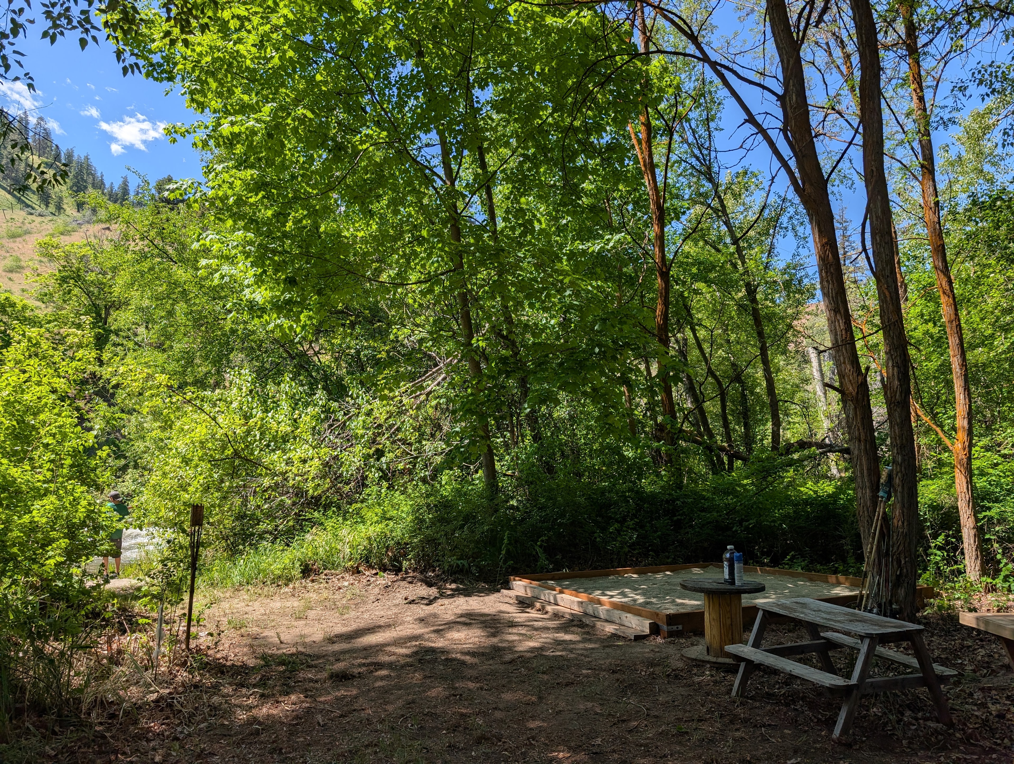 This is the site with a bench and sand area for soft ground. 