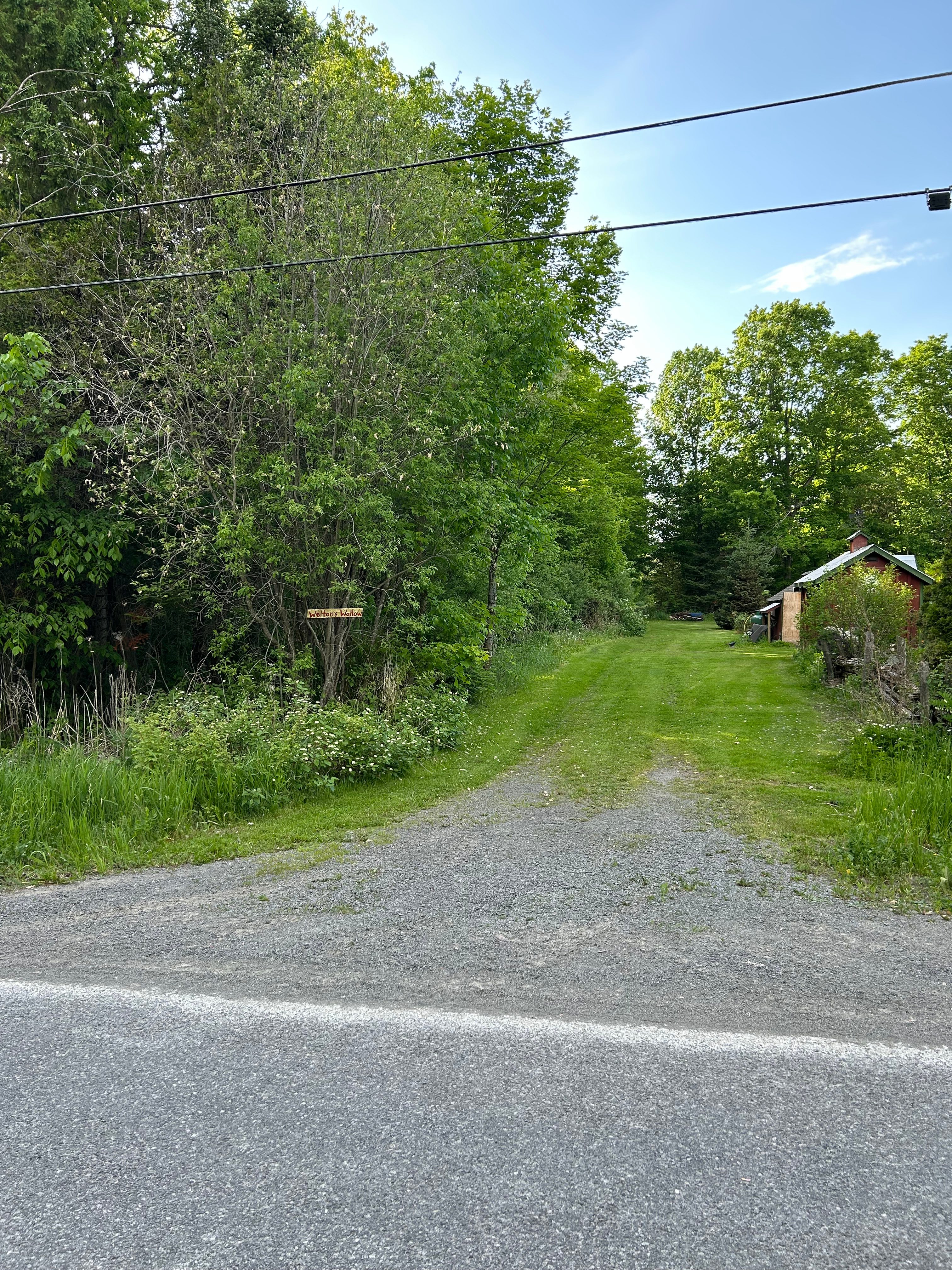 Look for the wooden sign “Welton’s Wallow” to the left 
