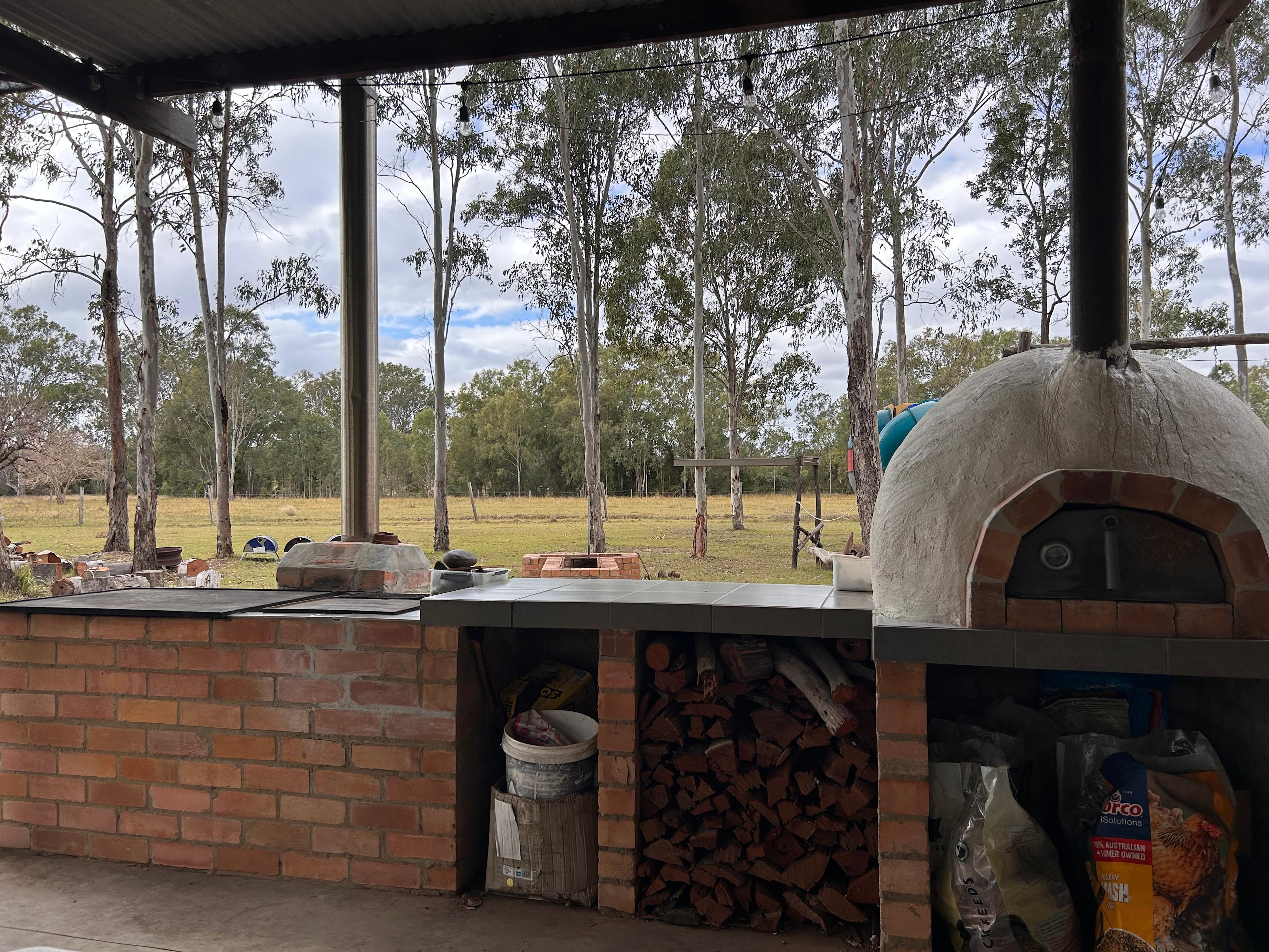 Pizza oven and large bbq area. Some of the many options for cooking.