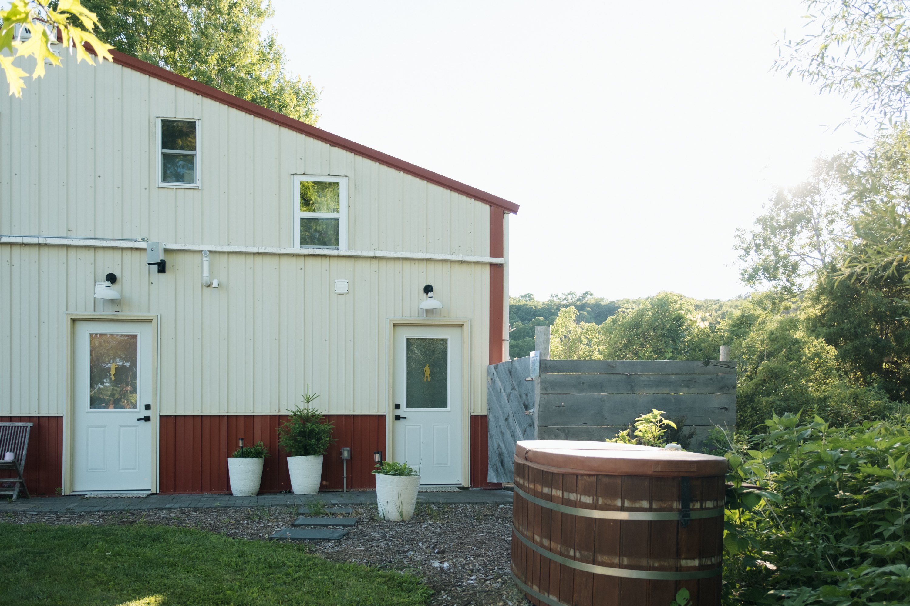 Restrooms, outdoor shower beyond the gate, and an outdoor tub soon to come.