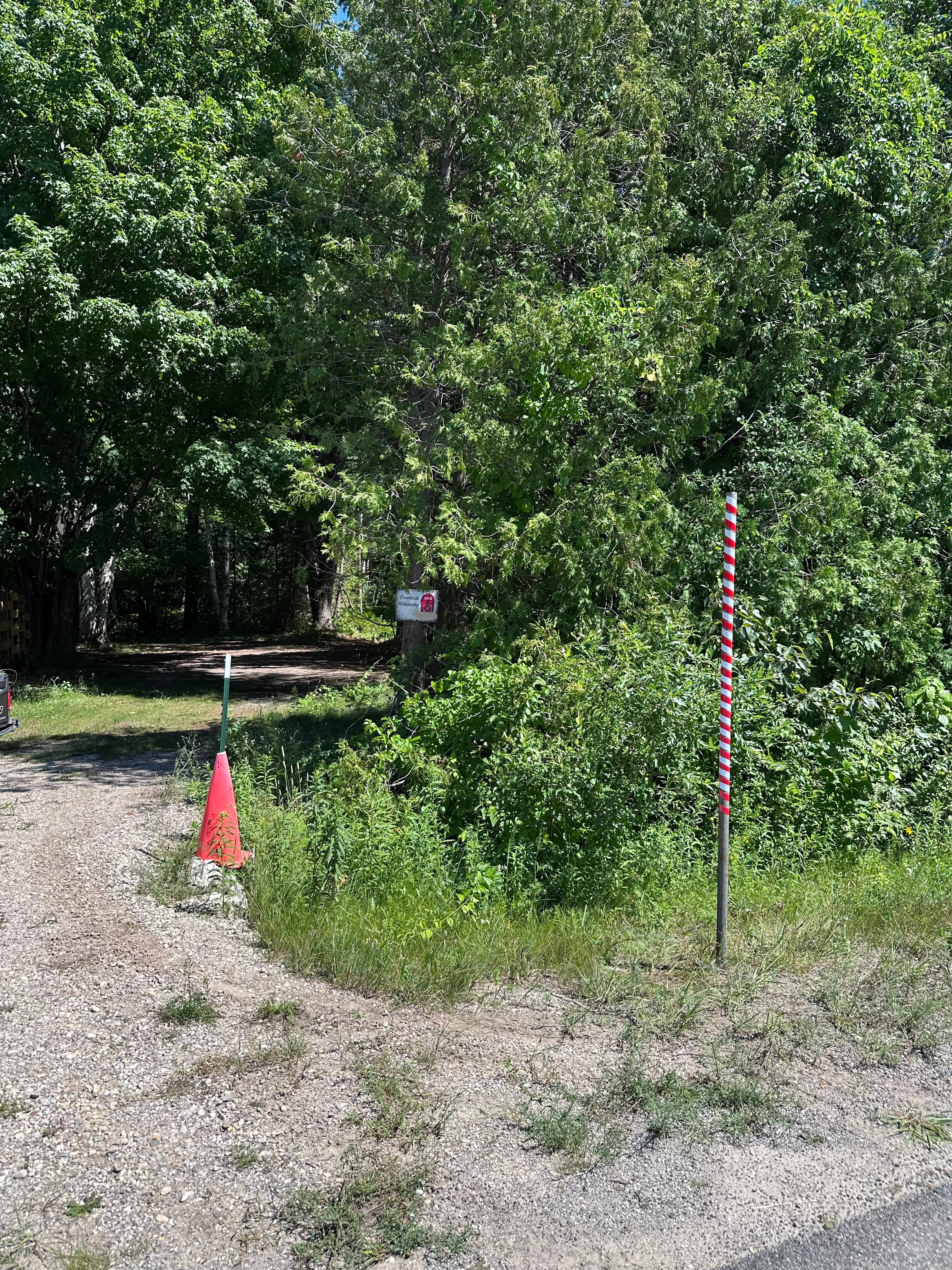 The red and white striped pole indicates the entrance to Creekside Hideaway
