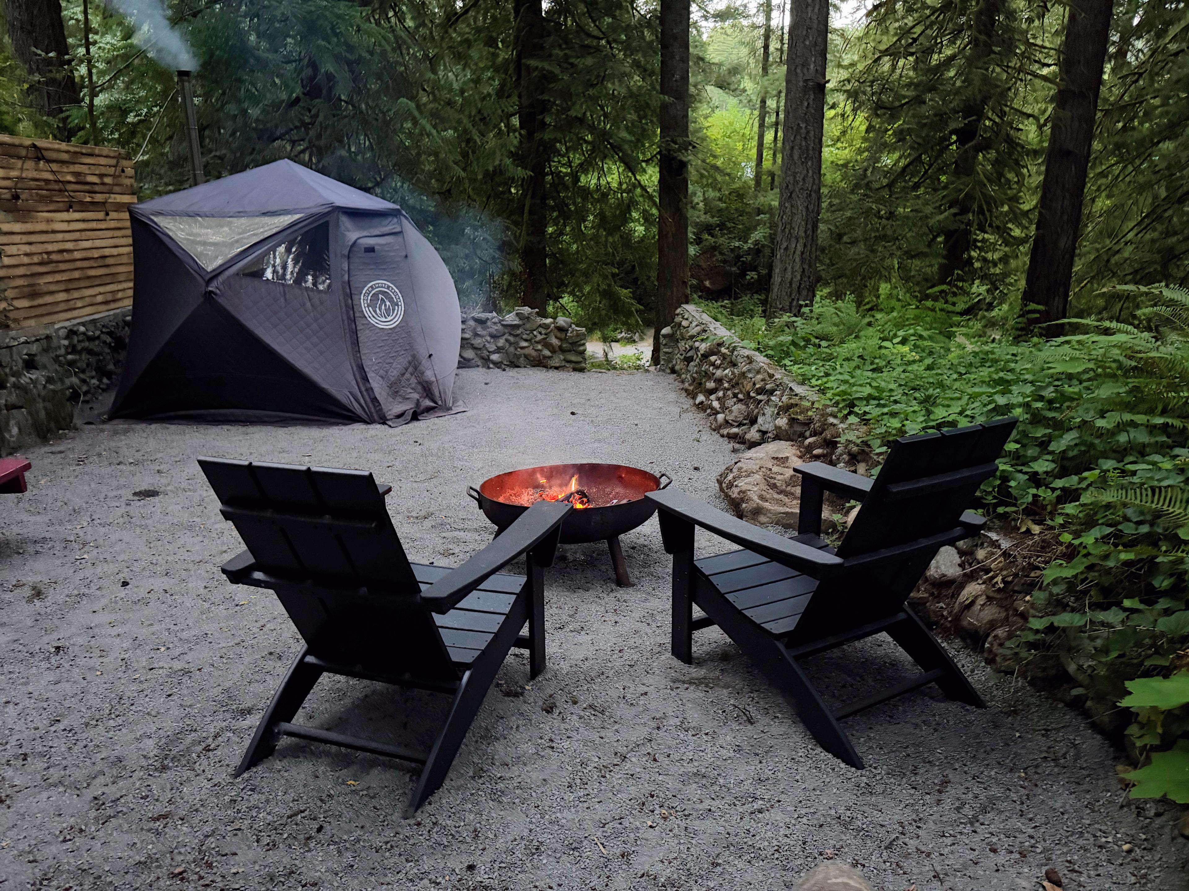 Guest amenity area: 4-person tent sauna, picnic table, and firepit with two Adirondack chairs.  
SAUNA CURRENTLY UNAVAILABLE
Wood-fired sauna prohibited during current burn restrictions.