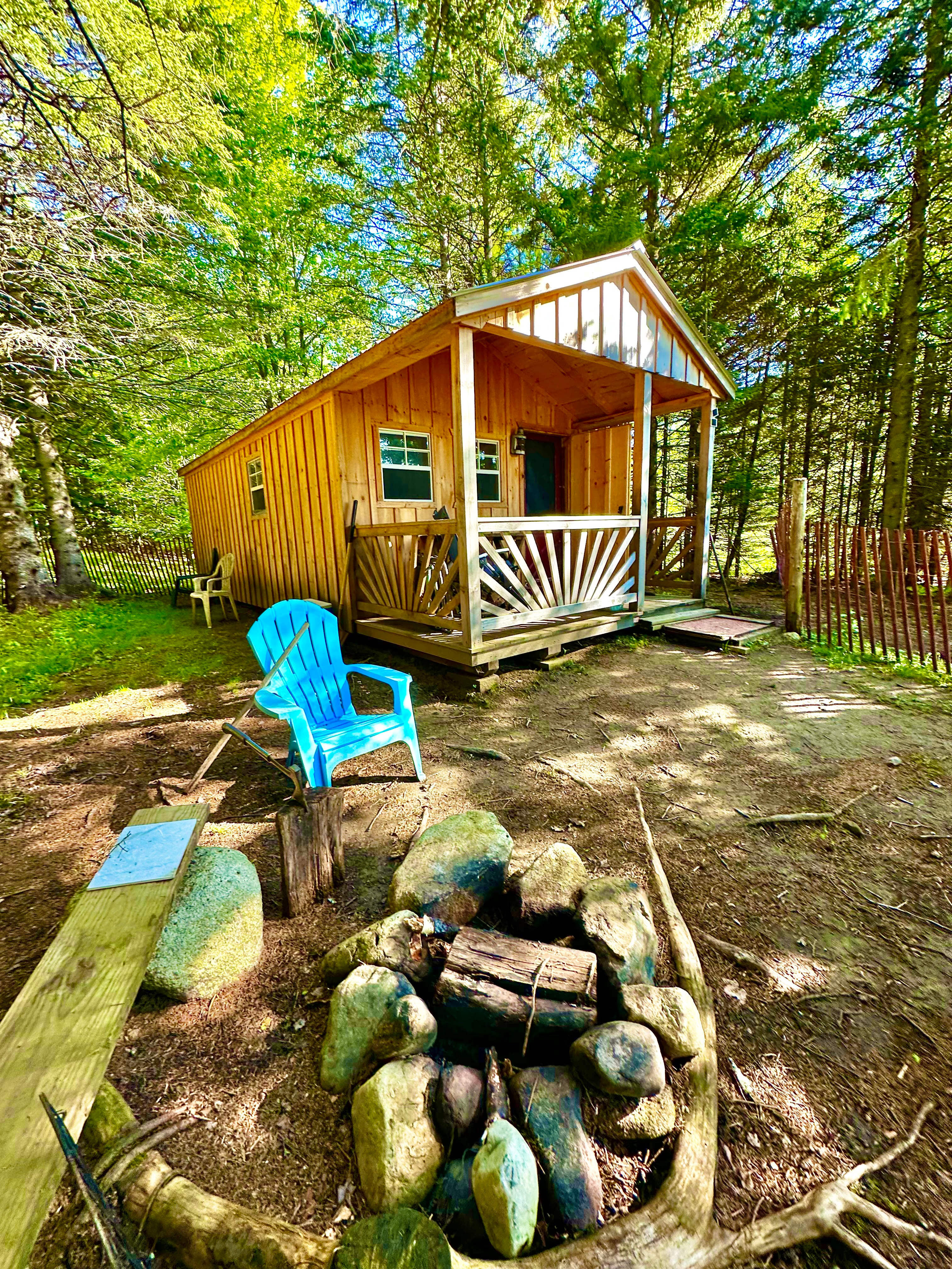 Lookout Cabin perched on a hill overlooking our own spring fed pond with Pisgah  Mountain and Mnt Hor in the backgrounding 