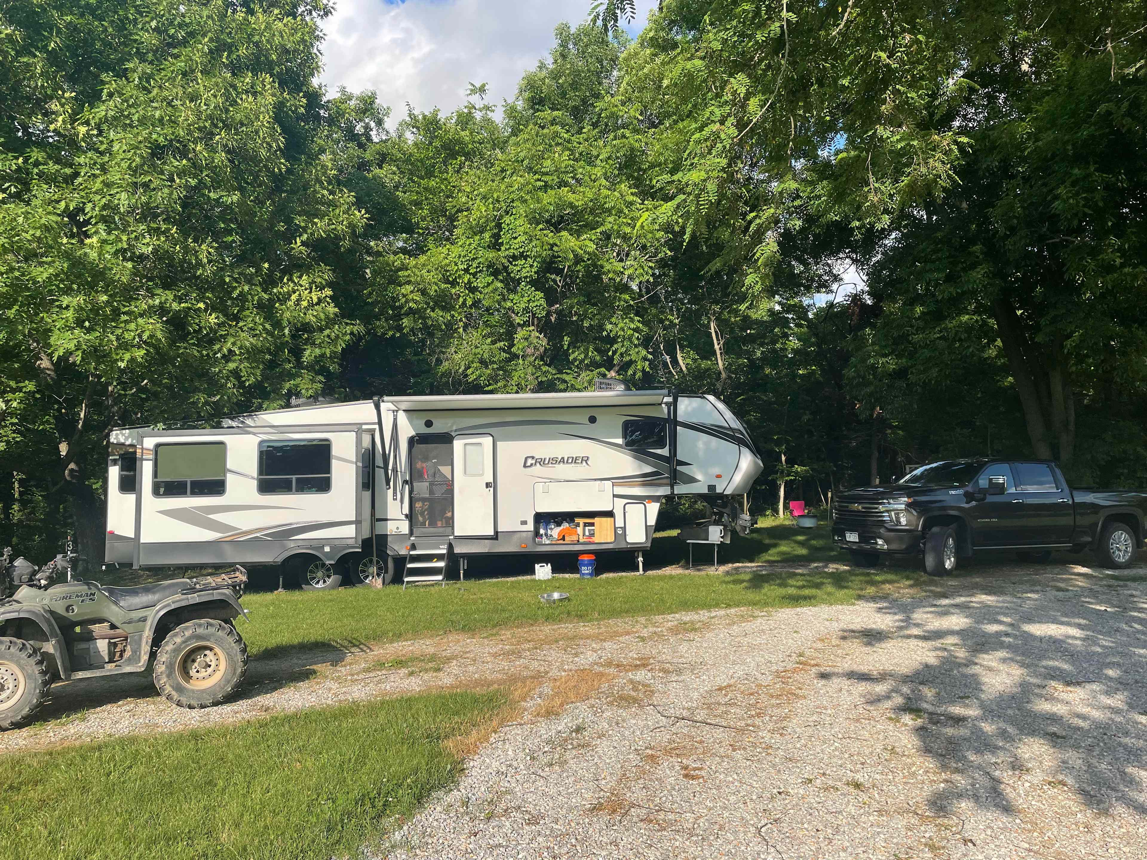 Site 3 with a 5th wheel camper backed in to the spot.