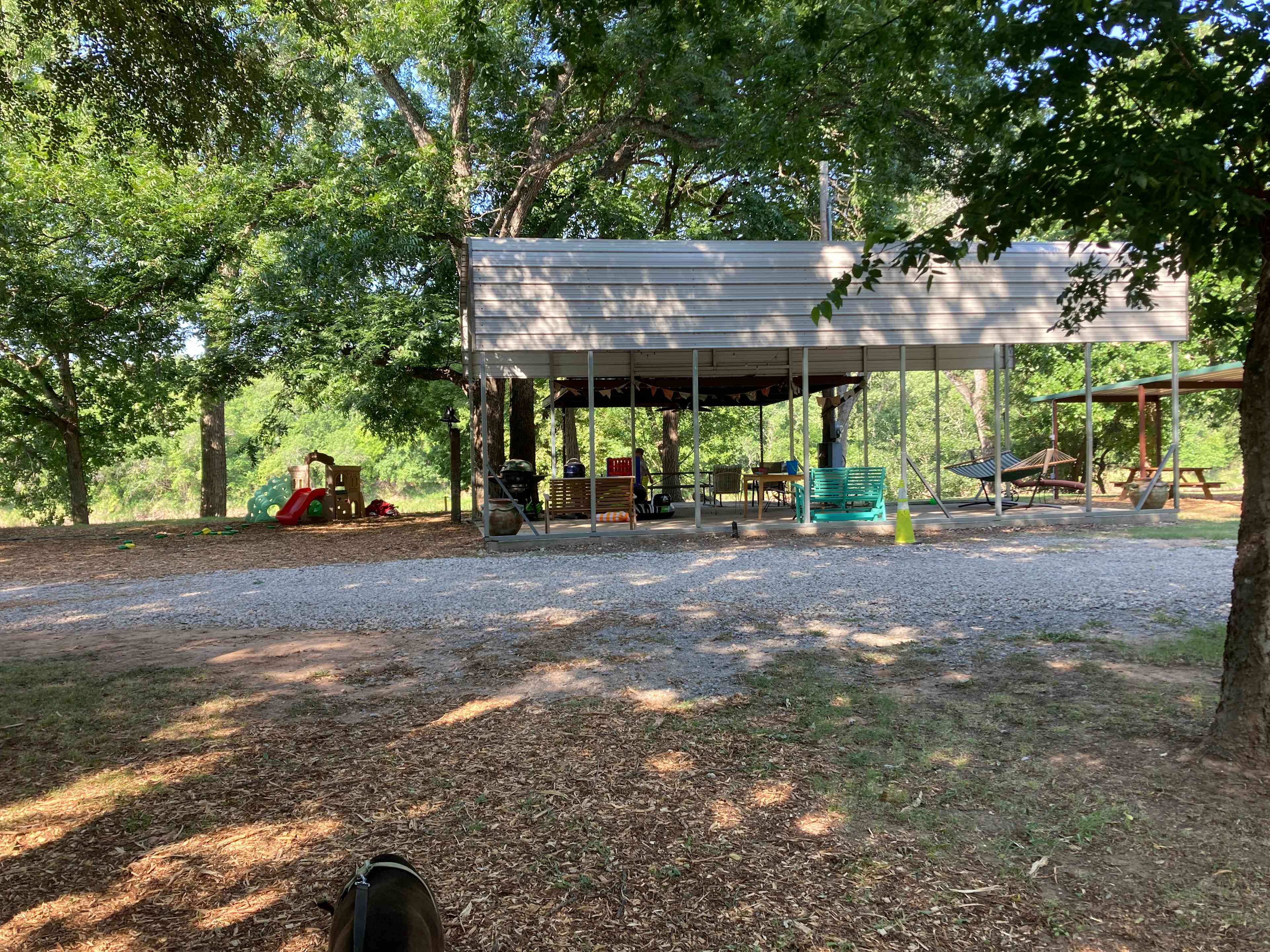 There is a large pavilion just in front of the dollhouse, just yards away from the river bank below. It has seating/picnic areas, as well as some things to keep smaller children entertained. 