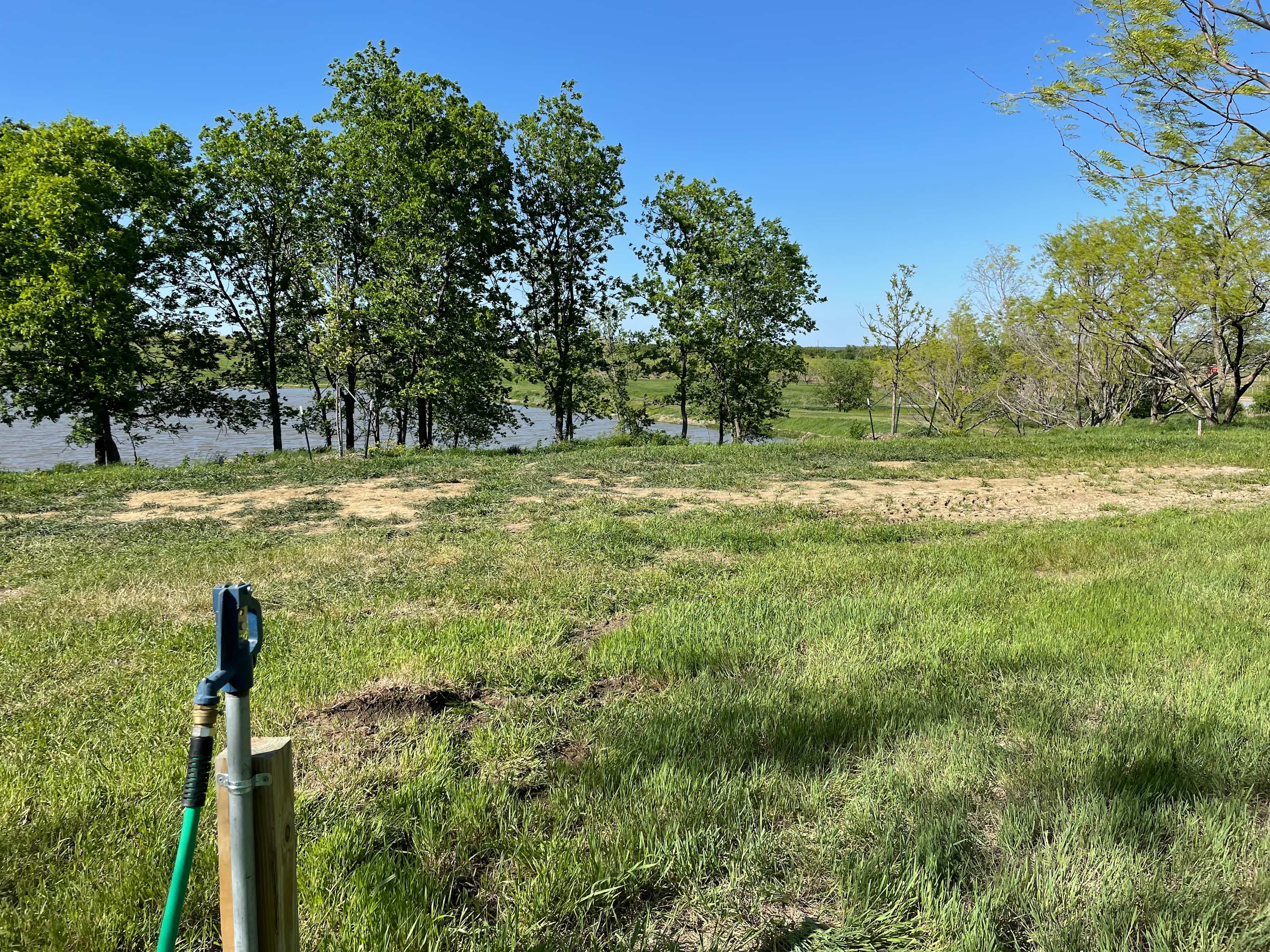 Campsites 1 looking toward the lake from the shared water hydrant. Campsite 2 is directly to the left (west).