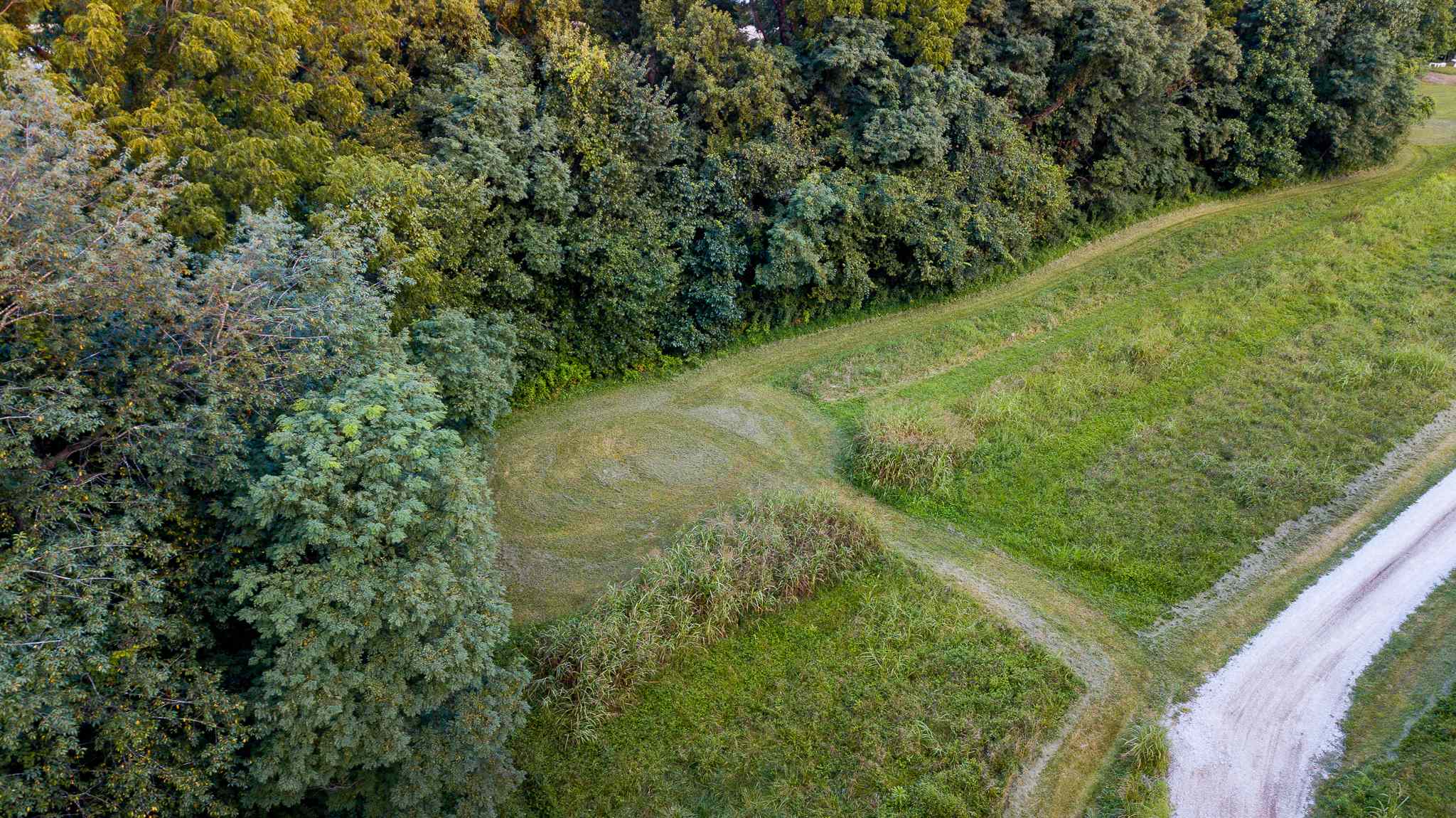 Aerial view of campsite number one with mowed grass entrance.
