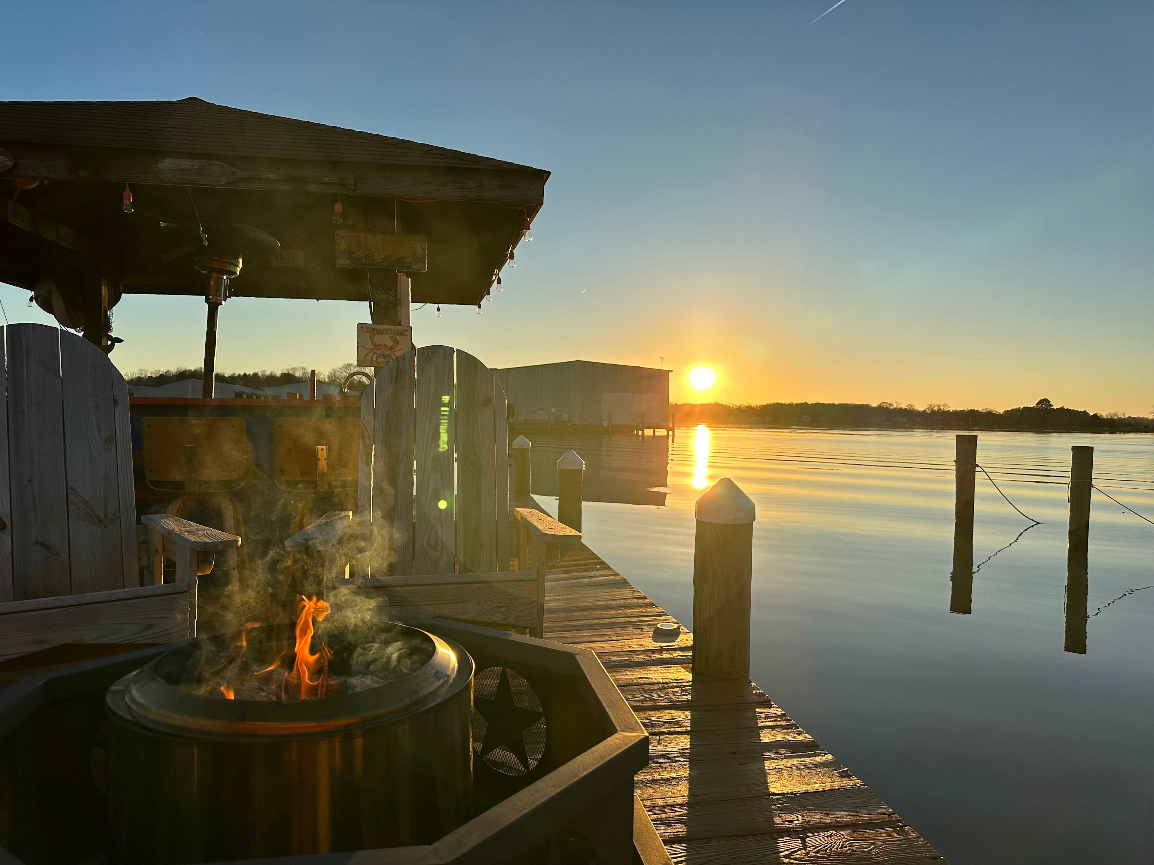 Enjoy sitting around the Solo firepit on Adirondack chairs watching the sunset