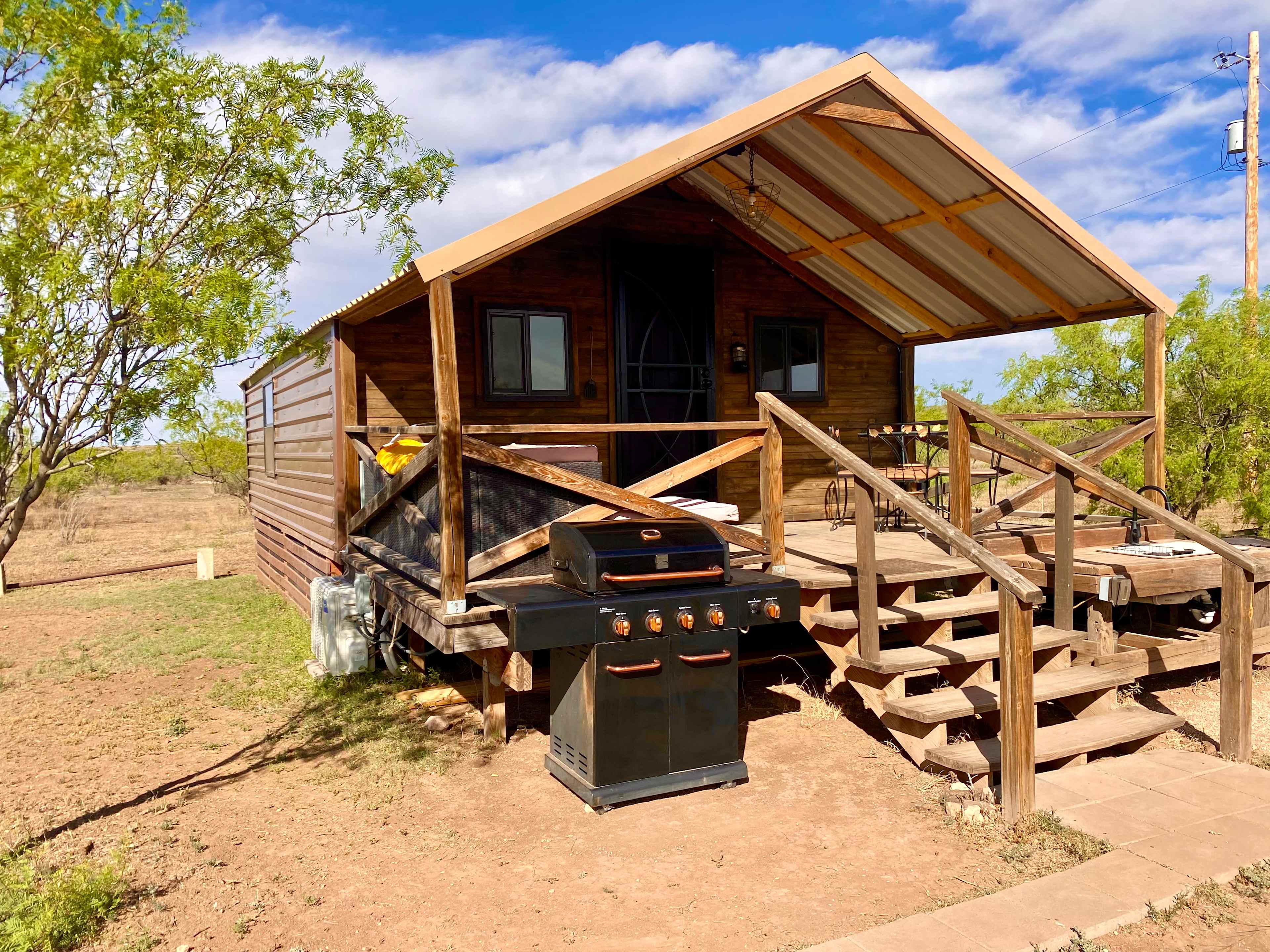 RRR Deluxe Cabin Offers its own private porch, large gas grill, outdoor sink and prep space.