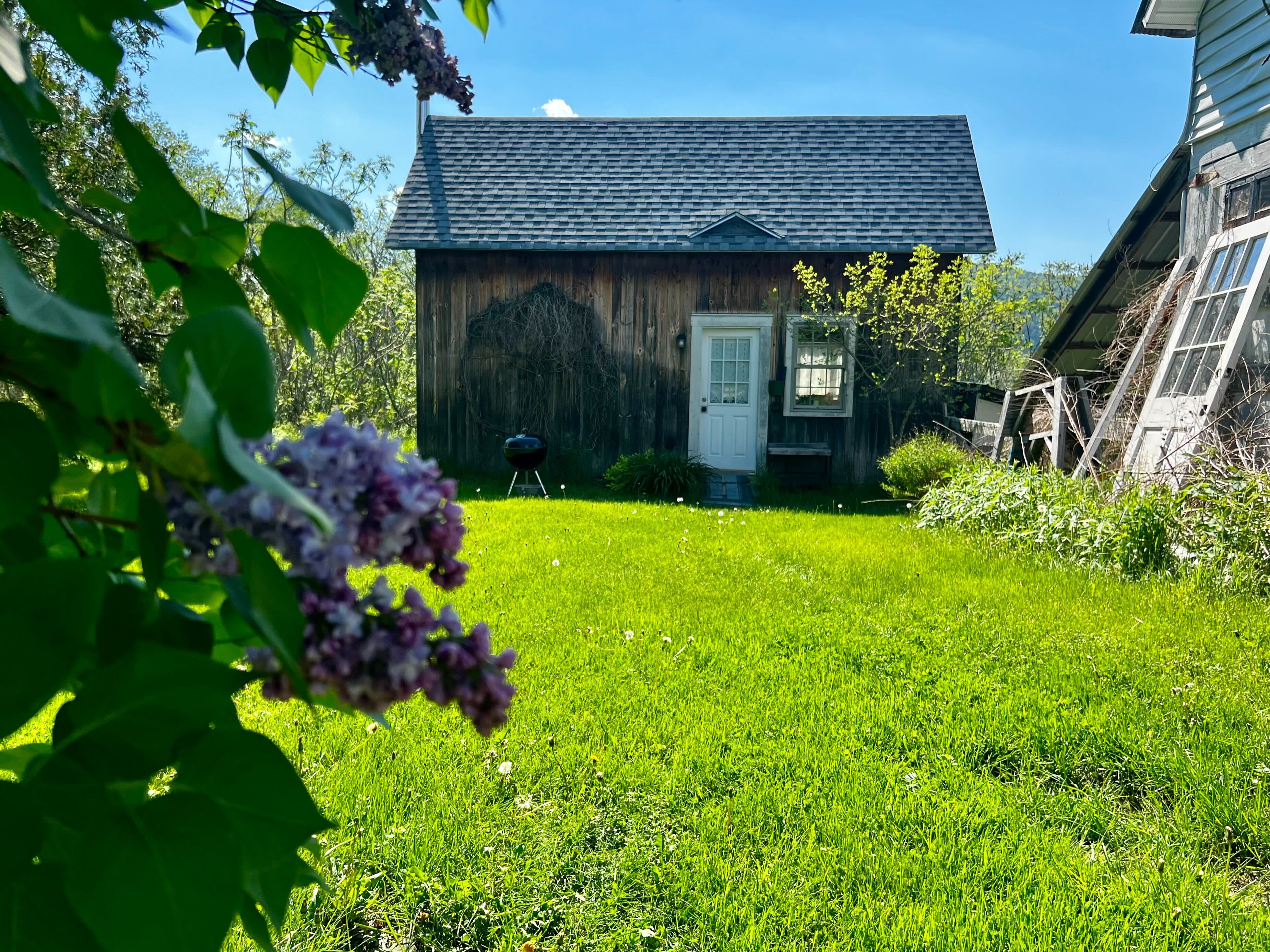 Tucked away from the main house behind a large lilac bush