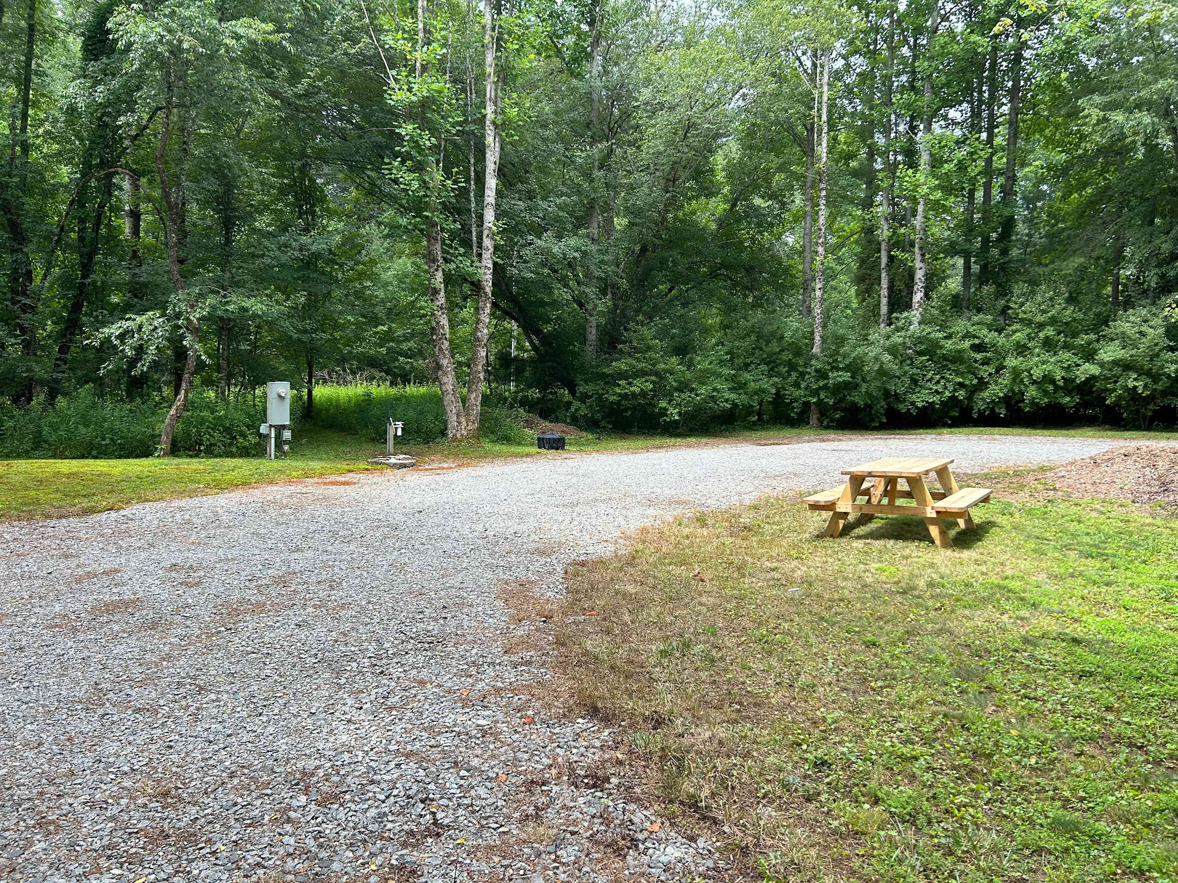 This is the parking pad of circular pull-thru site.  Pad is level for full 45’ rig, if needed.
