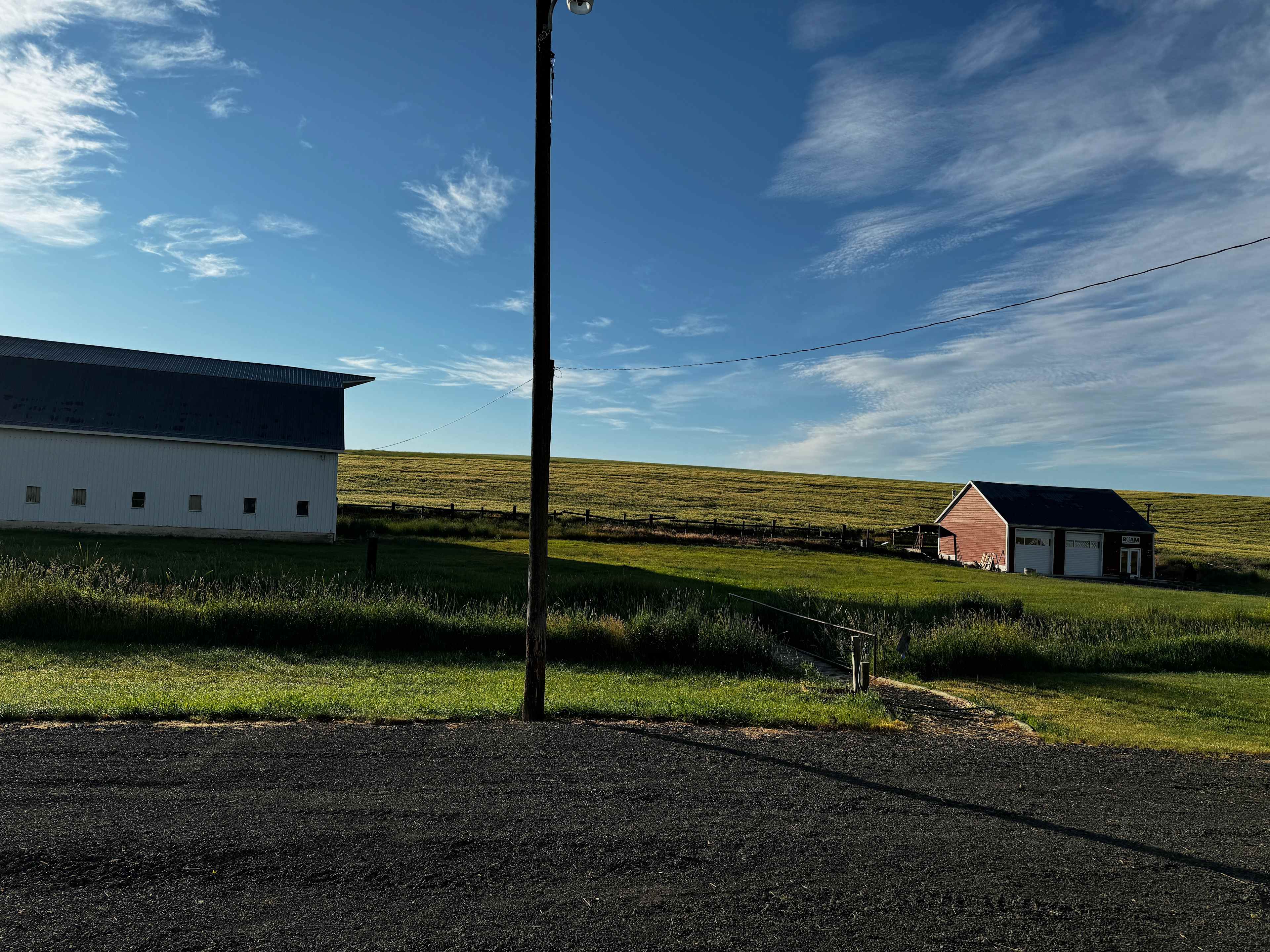 The idyllic pasture where you could set up camp with the coffee roastery for fresh morning brew on the right.