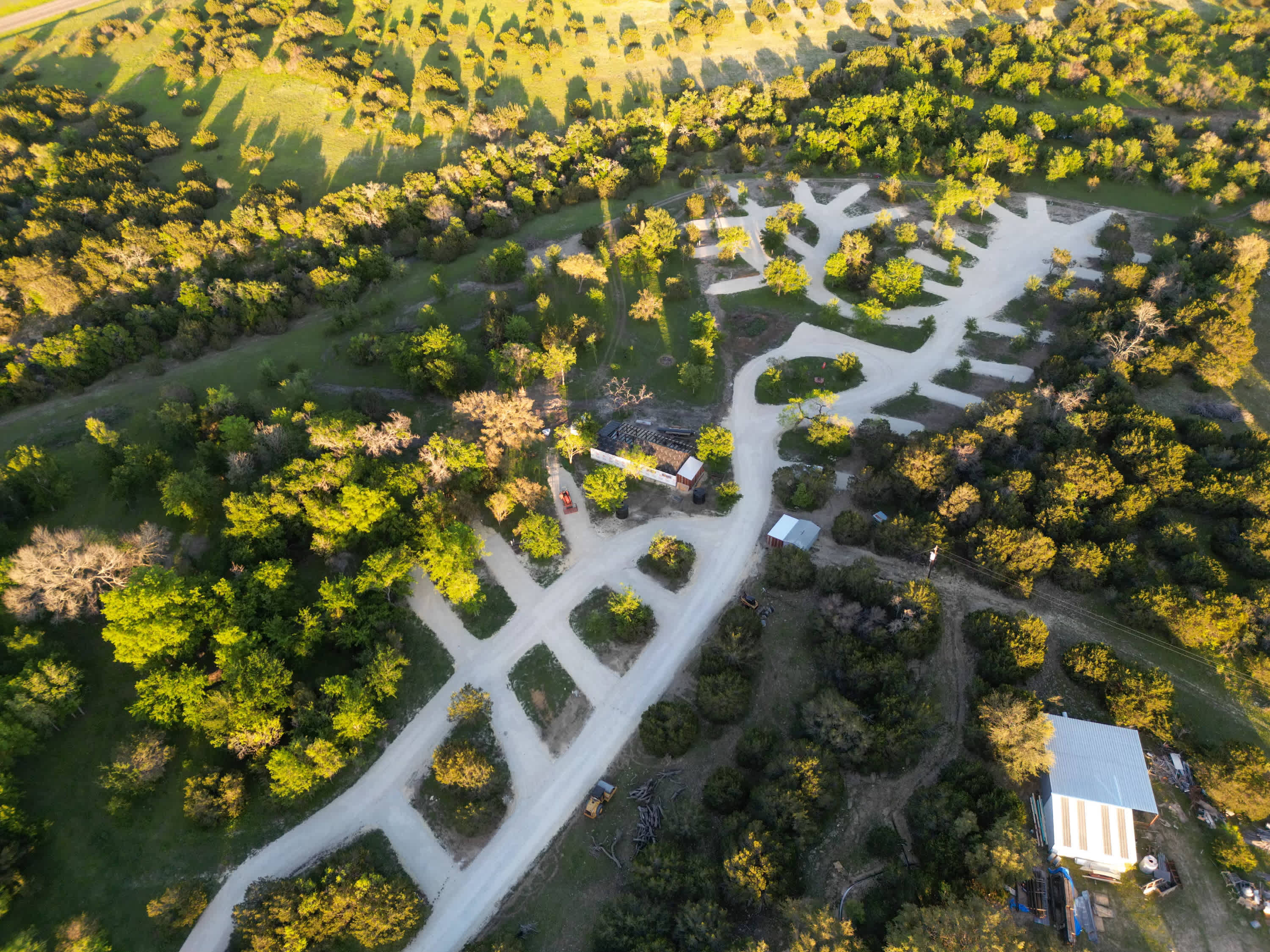 Multiple wooded RV slots generously spaced and close to amenities