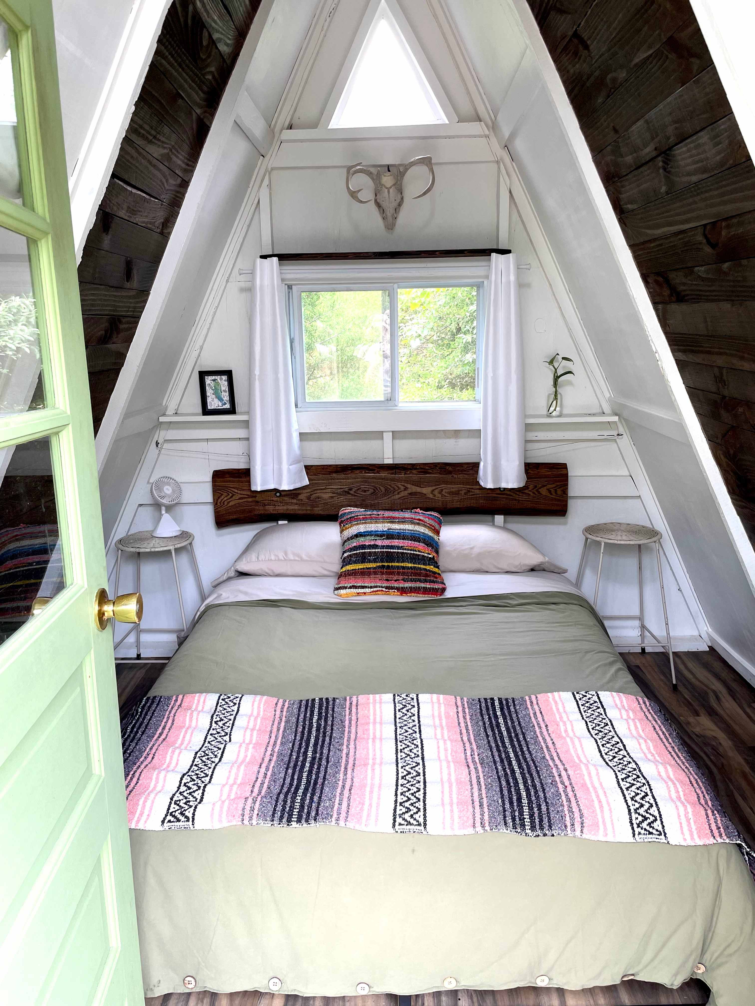 This cozy a-frame cabin has a full-sized bed with a comfy memory foam mattress.  Clean bedding provided.