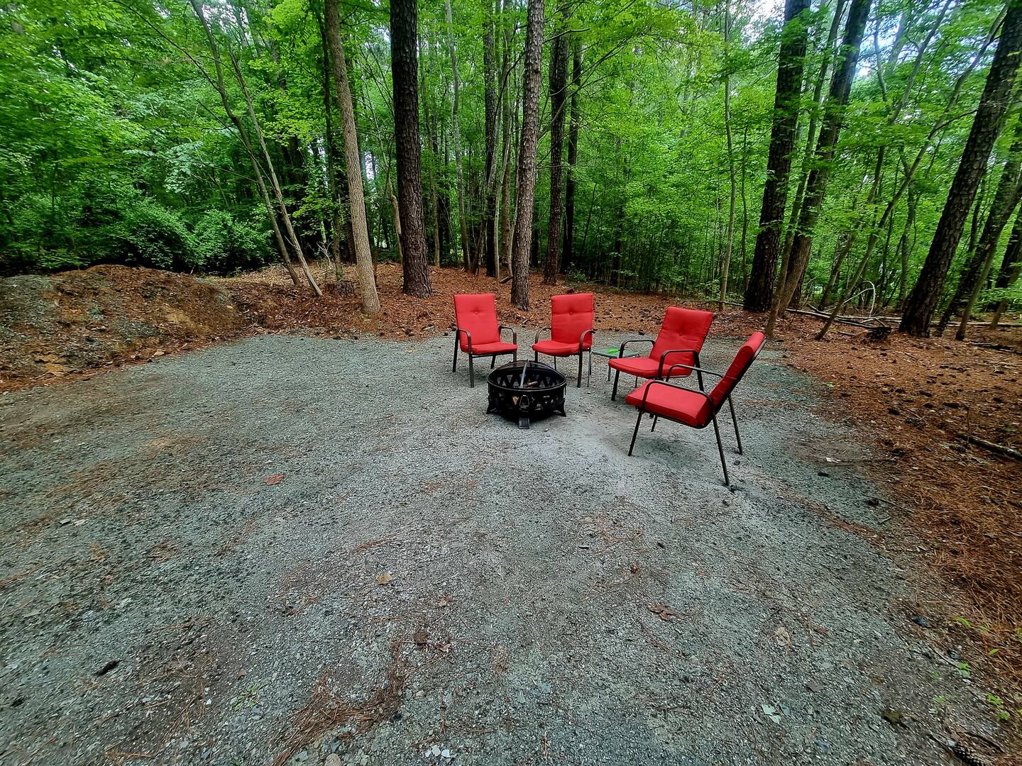 Wooded RV spot with campfire