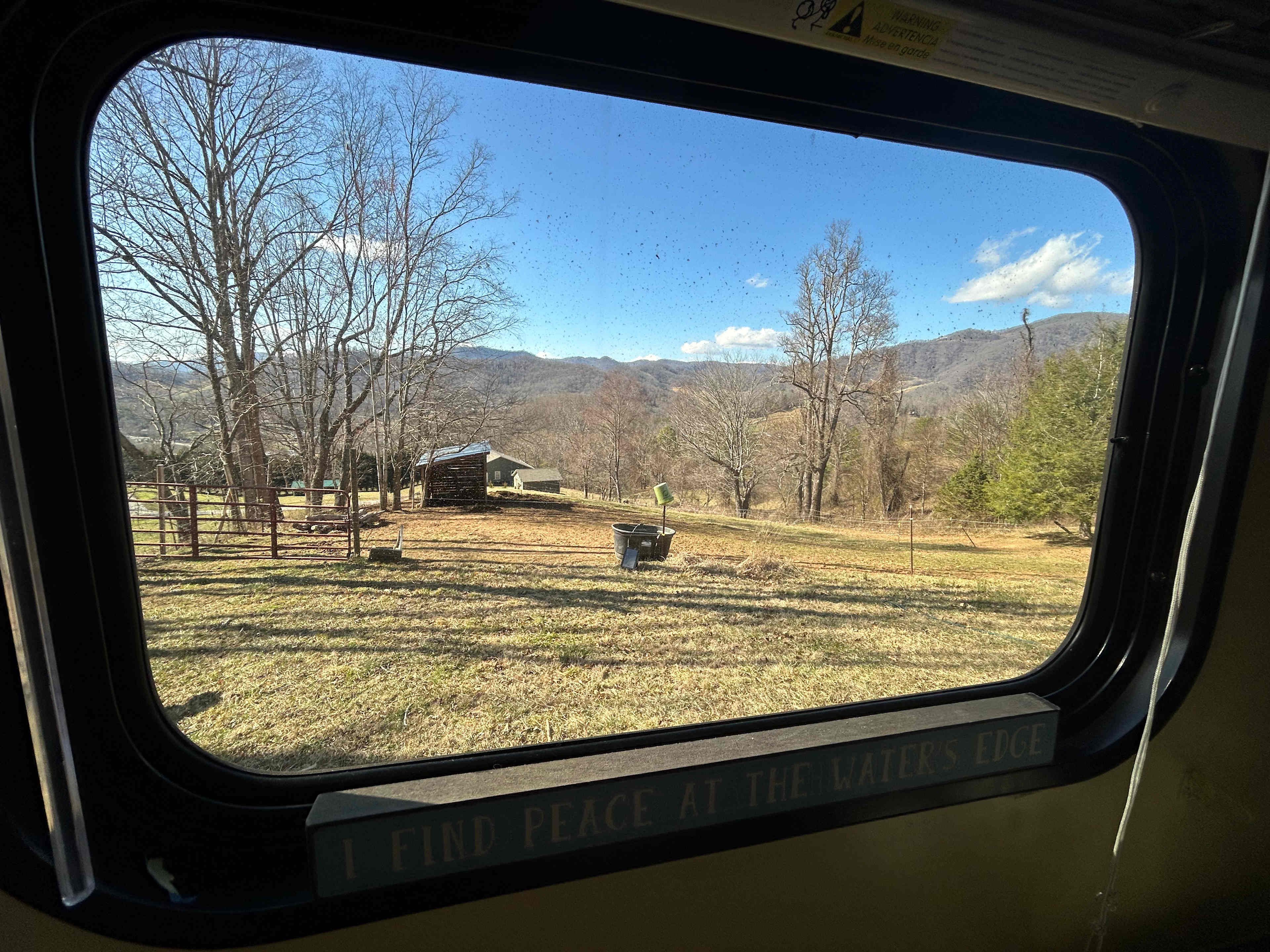 The literal view from the window :) Faces out towards a panoramic mountain view and equine and goat pastures.