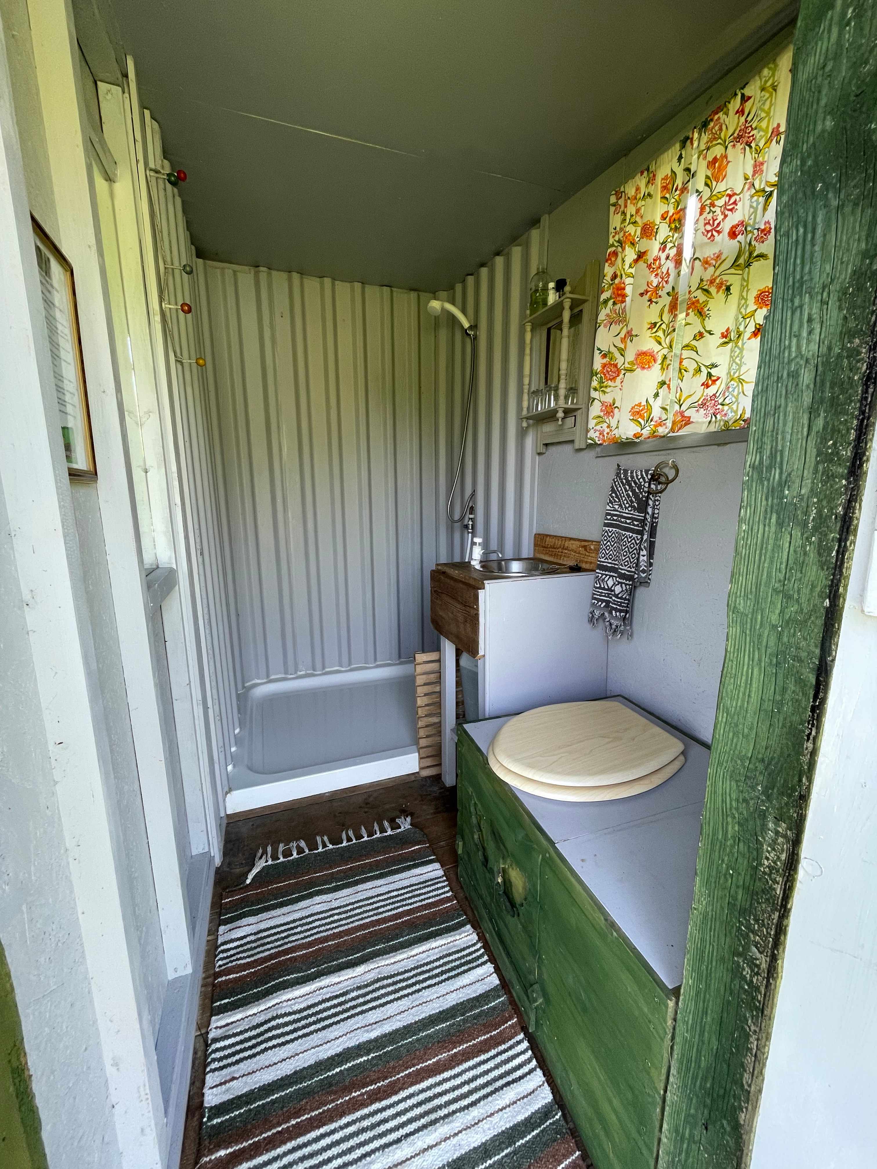 Gas powered hot shower with compost loo