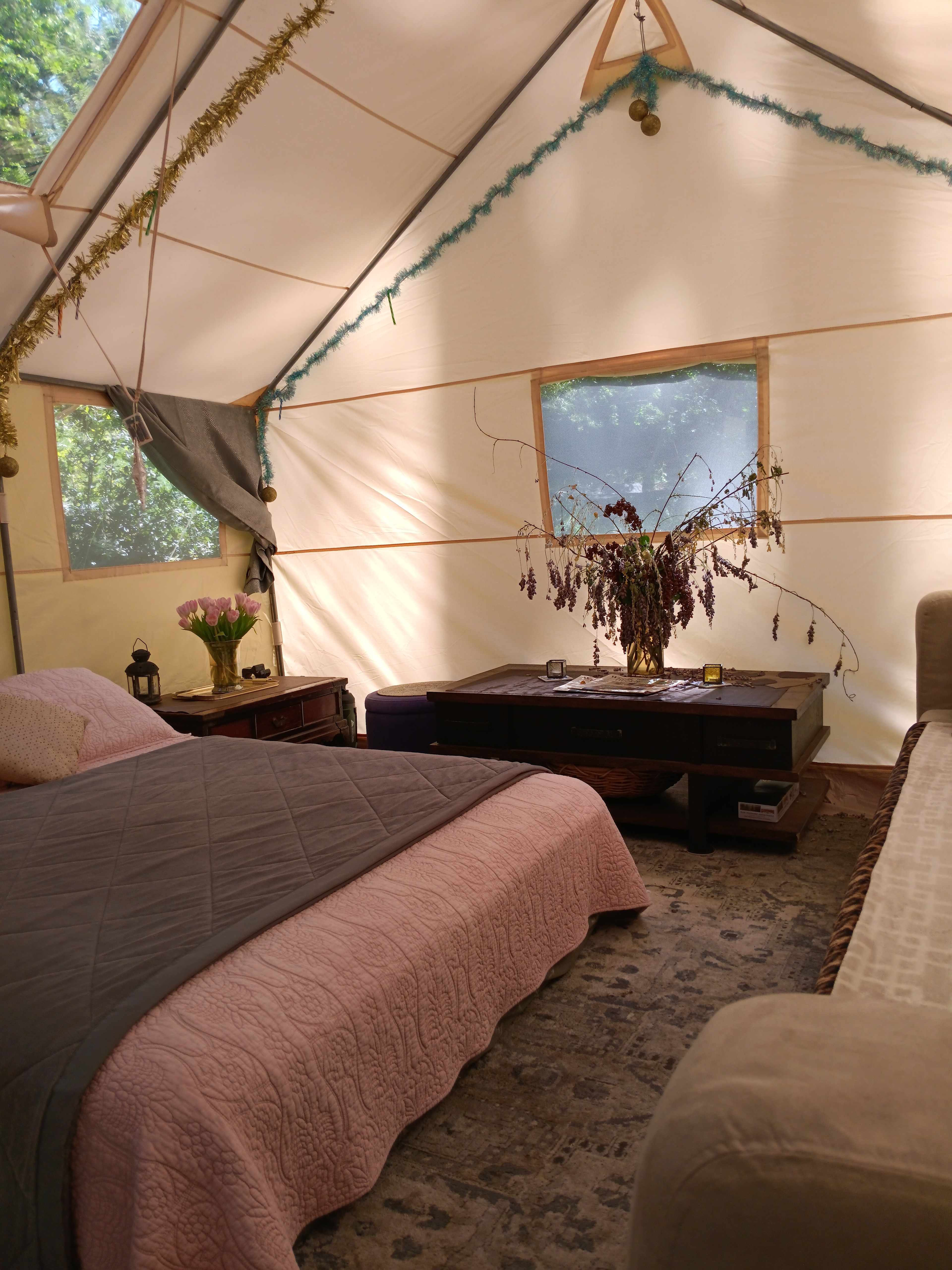 The big coffee table and ottomans make eating in the tent comfortable.