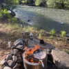 Camp next to the river on a ranch!