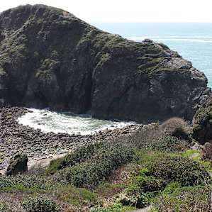 This is the rocky beach after a wave has come through the arch in the rock. It's gorgeous down there. People also hike up the rock for a view from the top. It's initially quite the scramble but I saw all kinds of people doing it.