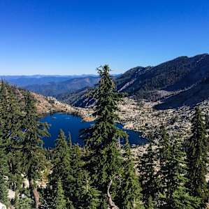 From Big Flat, a few mile hike will take you to Caribou Lake. Big Flat itself has plenty of space for car and tent camping with a stream running next to it. There is plenty of shady spots available. Many hiking trails start here.