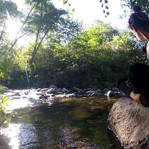 A little upstream from the swimming spot, there's a rockier and more secluded spot to sit or swim.