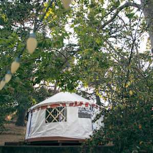 The yurt sits on top of the concrete ruins of a house (a duplex home to two Navy civilian families for more than 45 years, Myrna tells us.)