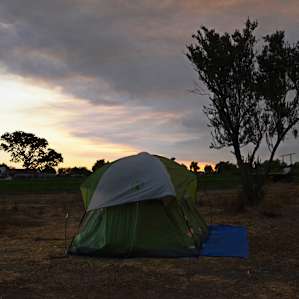 Camping on the farm. Remnants from the Rey fire are still visible in the sky.