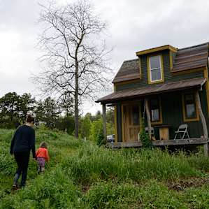 The cabin sits atop a hill.
