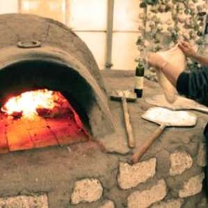 Me in all my chef glory! Making a brick oven pizza, truly an added treat to this whole experience!
